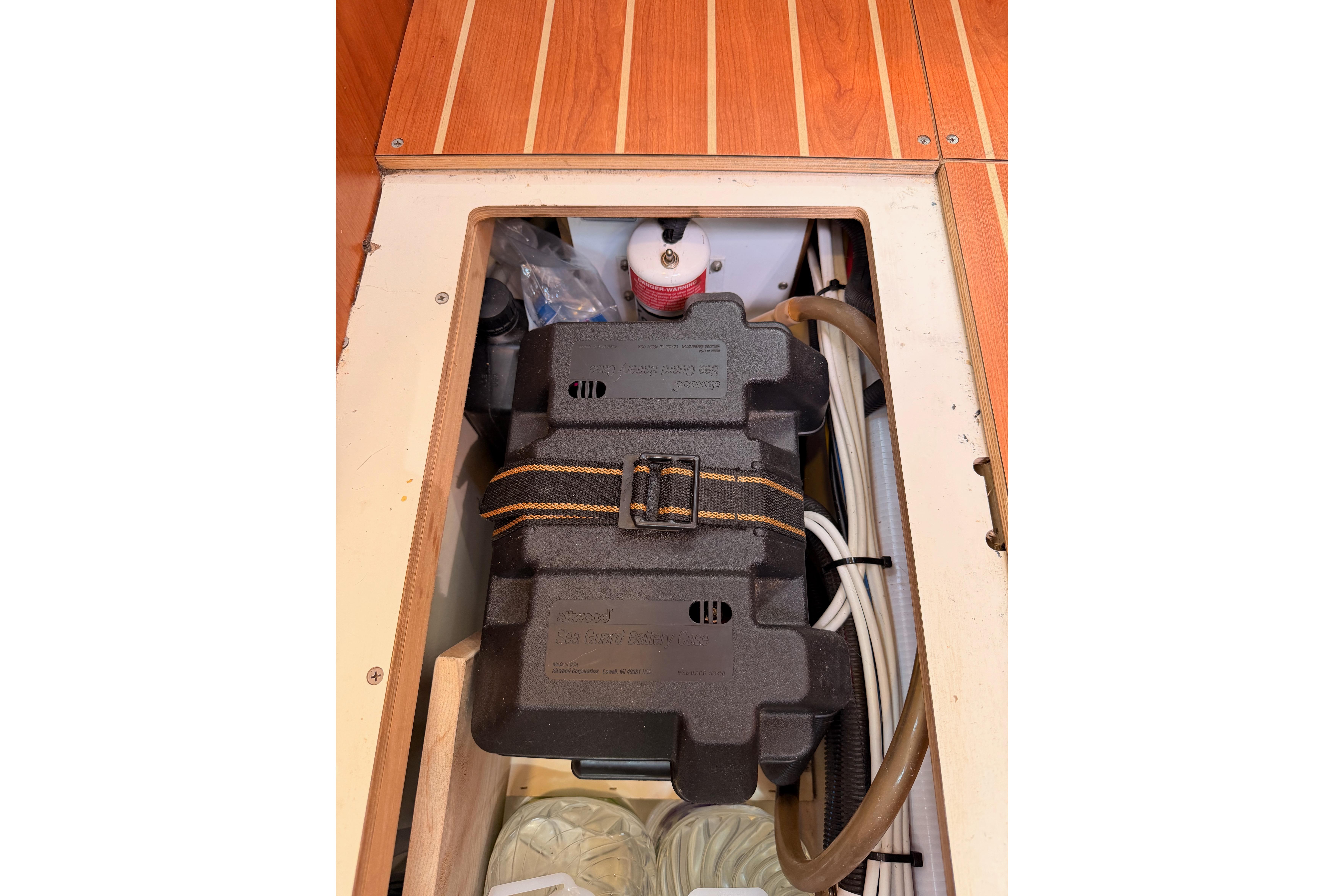 Interior view of 2008 Hunter 45 Deck Salon, showcasing storage compartment and equipment.