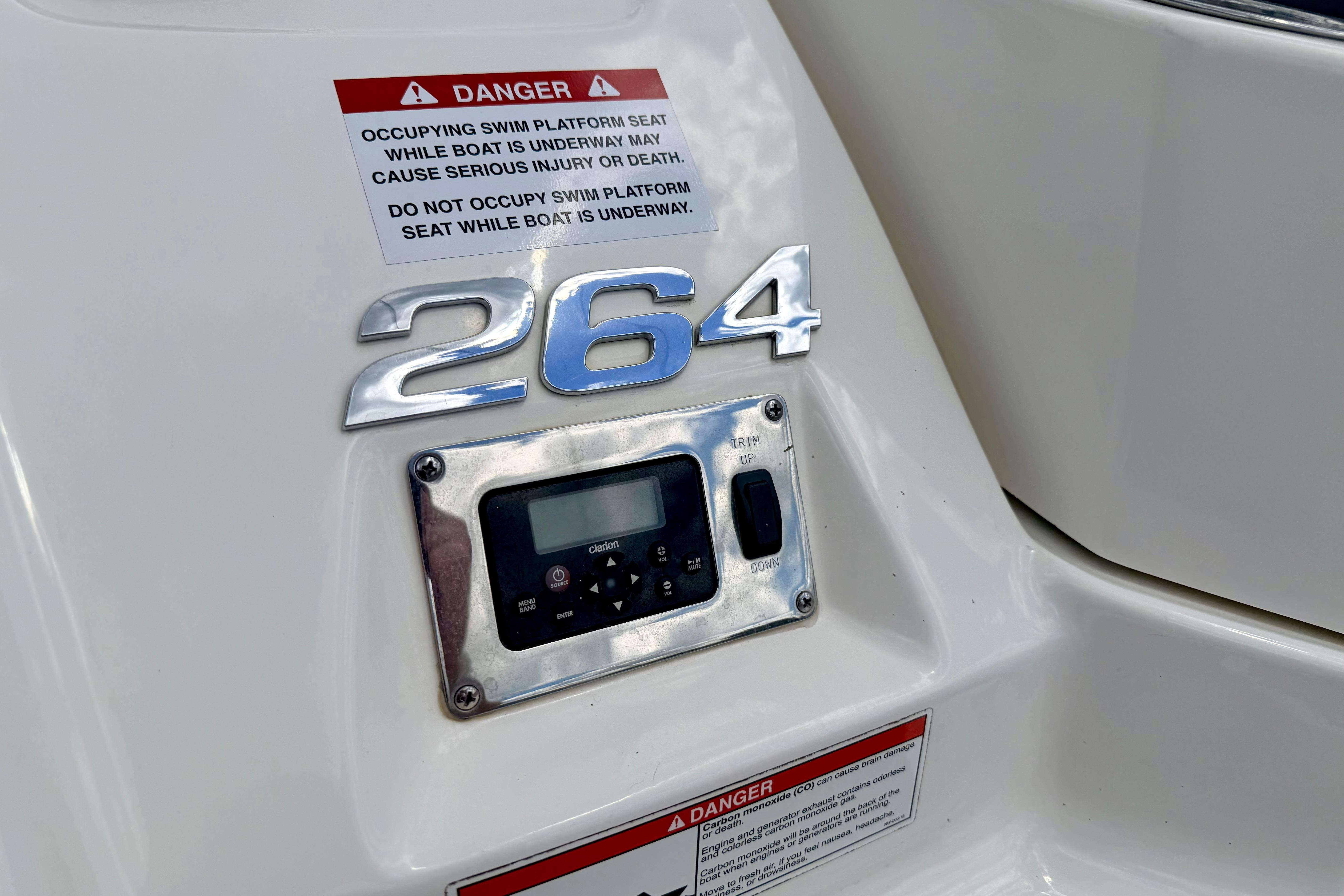 2015 Chaparral Sunesta 264 boat control panel with safety warning labels.