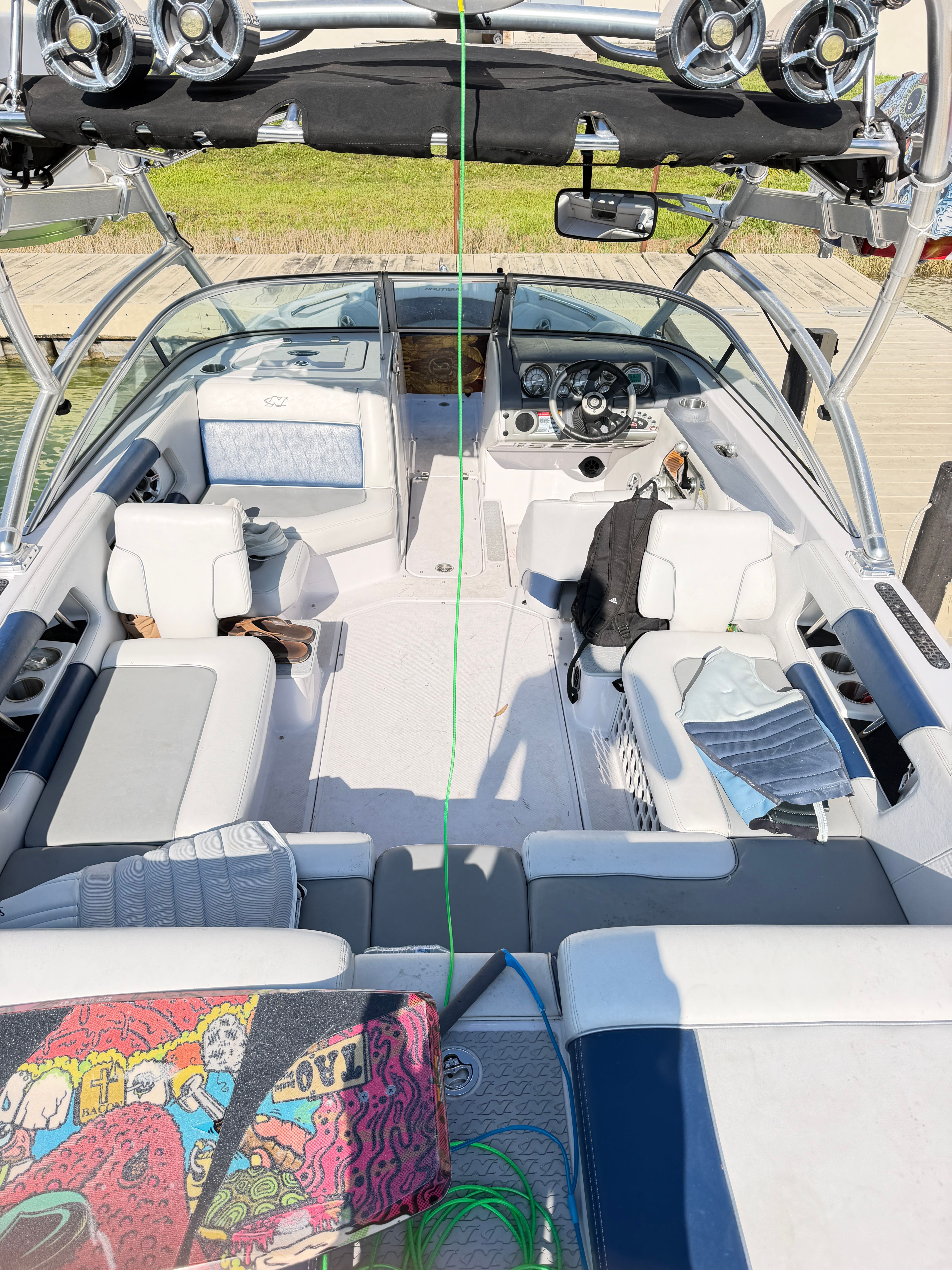 Interior of a 2008 Nautique 236 Team Edition boat with wakeboard.
