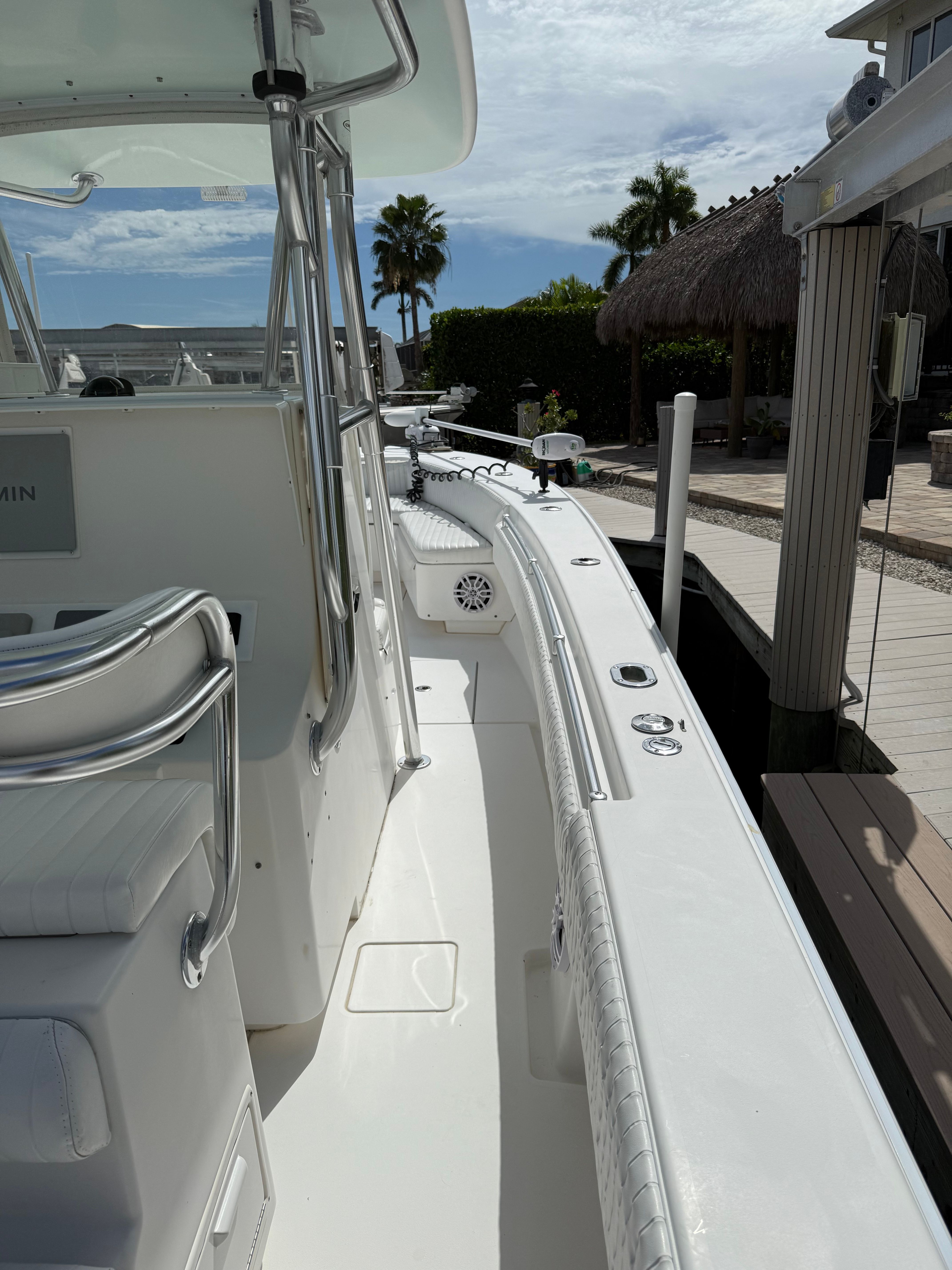 2012 Contender 32 ST boat docked under sunny skies.