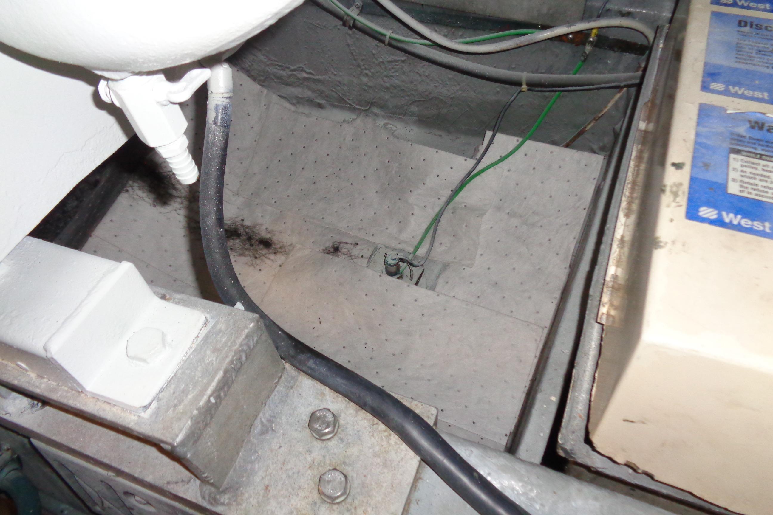 Engine compartment of 1981 Hatteras 48 Cockpit Motor Yacht with visible wiring and components.