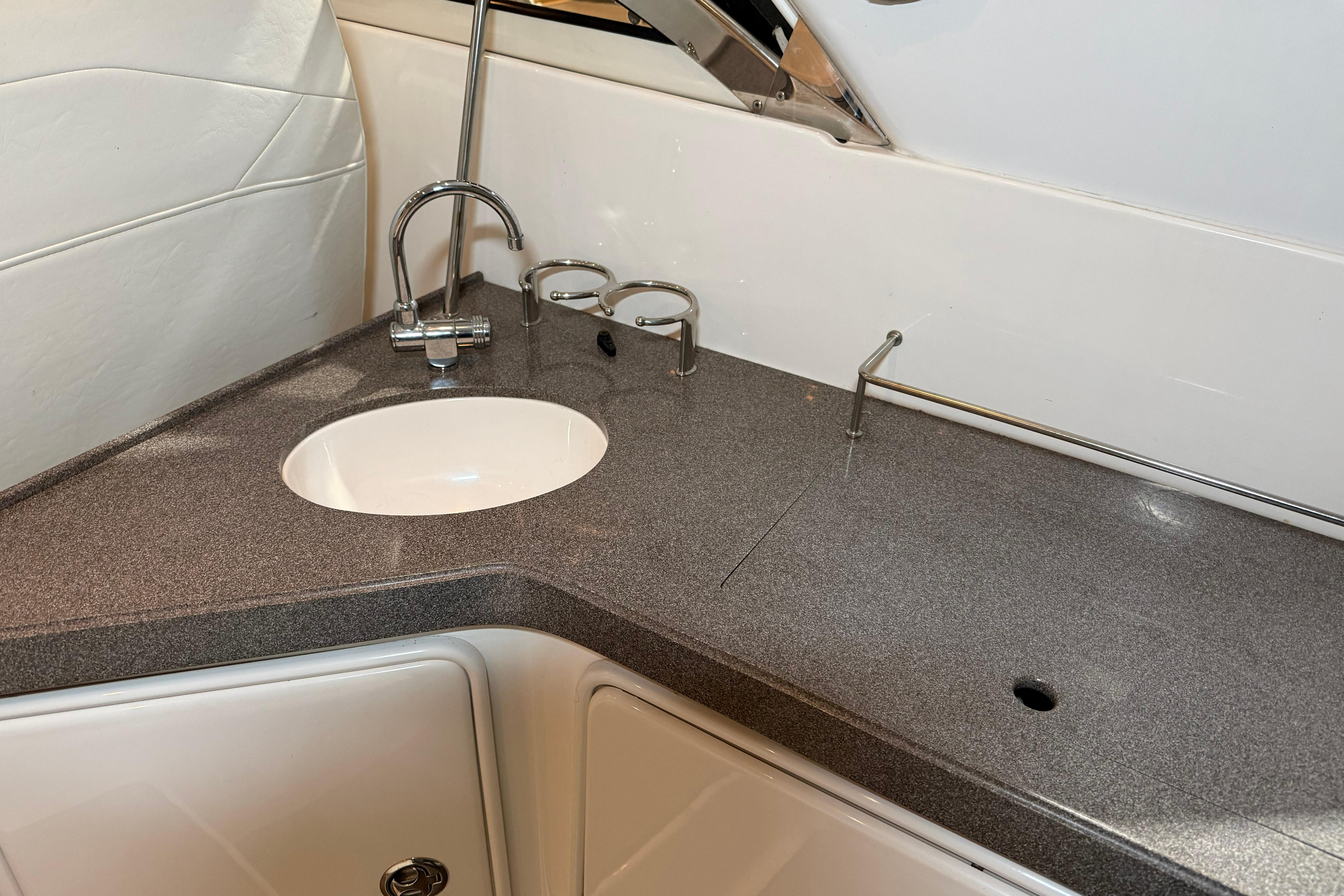 2007 Regal Commodore 3760 IO boat interior with sleek countertop and sink.