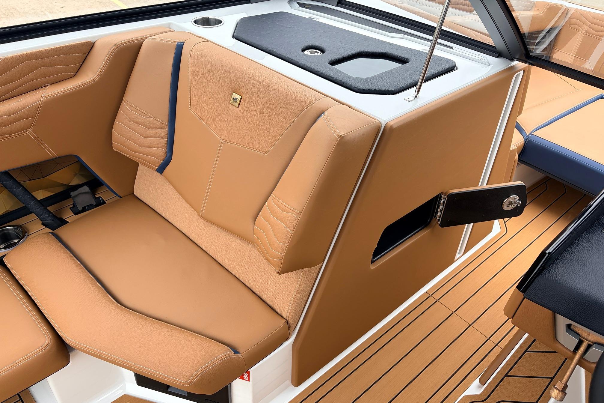 2026 Nautique Super Air Nautique G25 interior with tan leather seating and sleek design.
