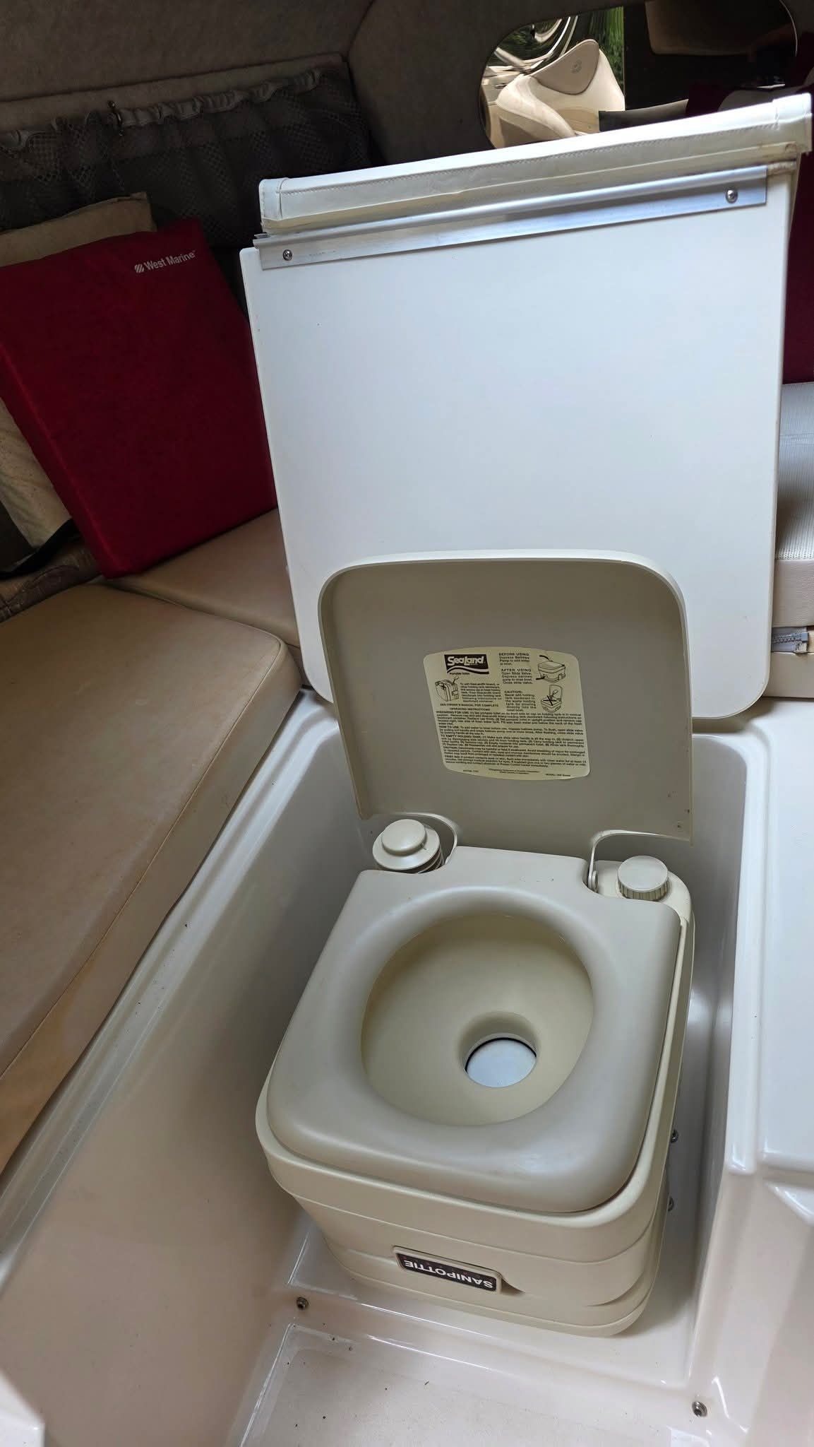 Interior view of a 2006 Stingray 250 CR featuring a portable toilet.