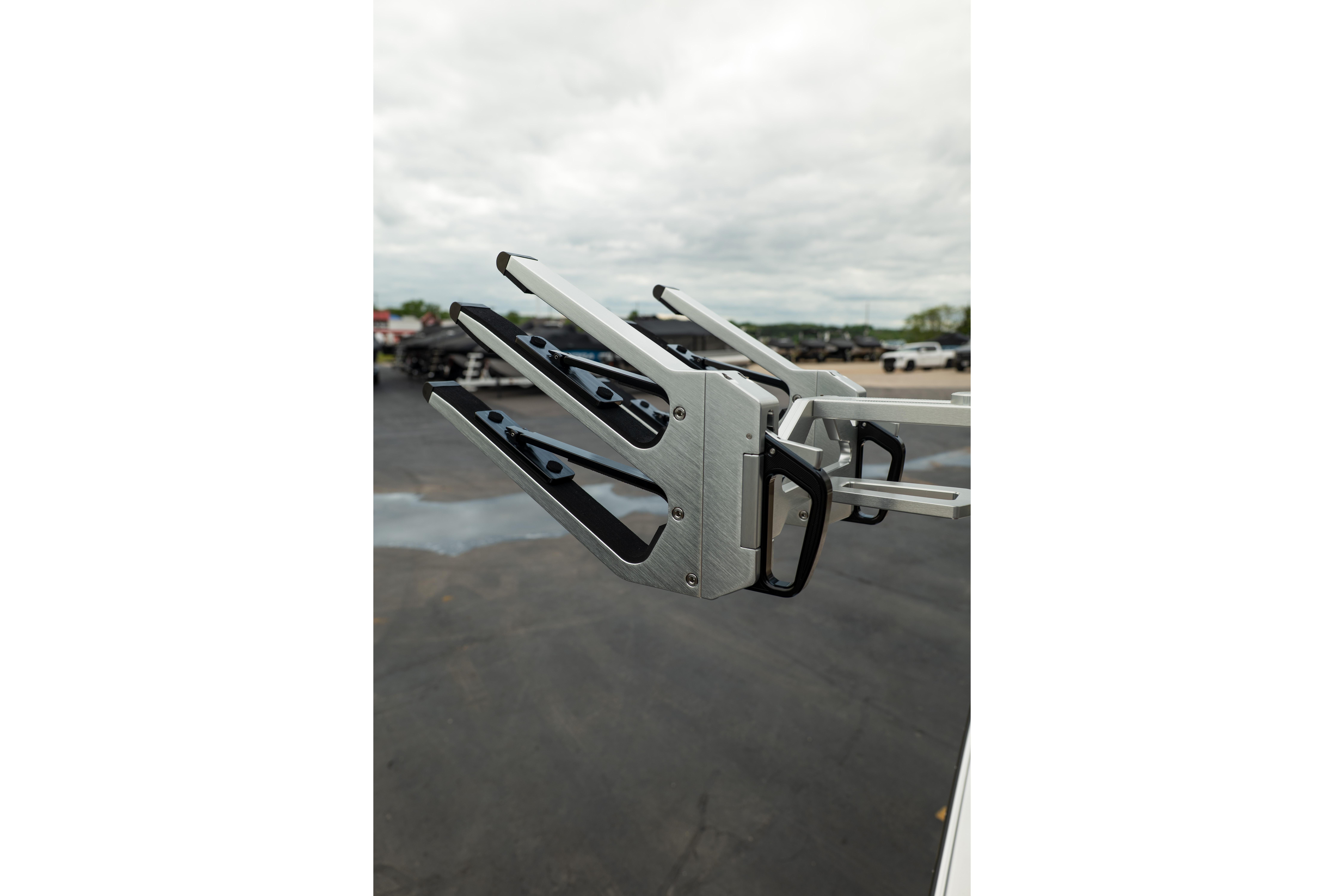 2026 MasterCraft NXT23 wakeboard rack on a cloudy day.