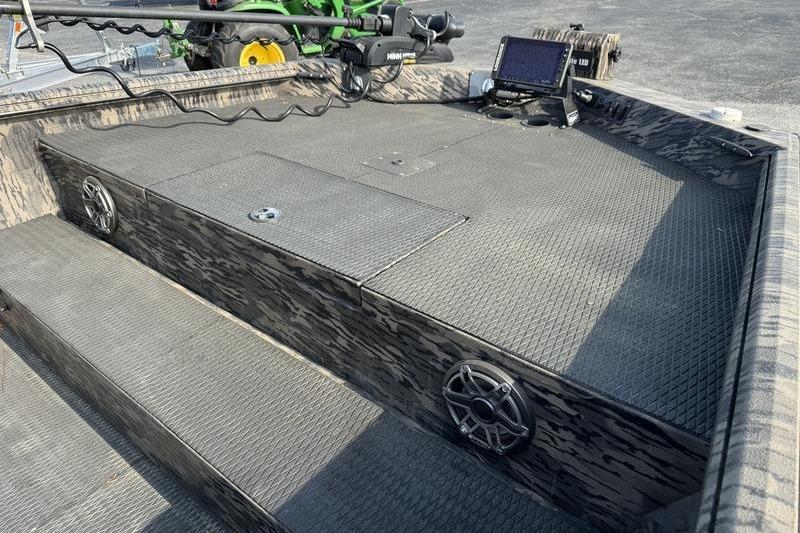 2023 Havoc 1756 MRST boat interior with speakers, control panel, and textured flooring.