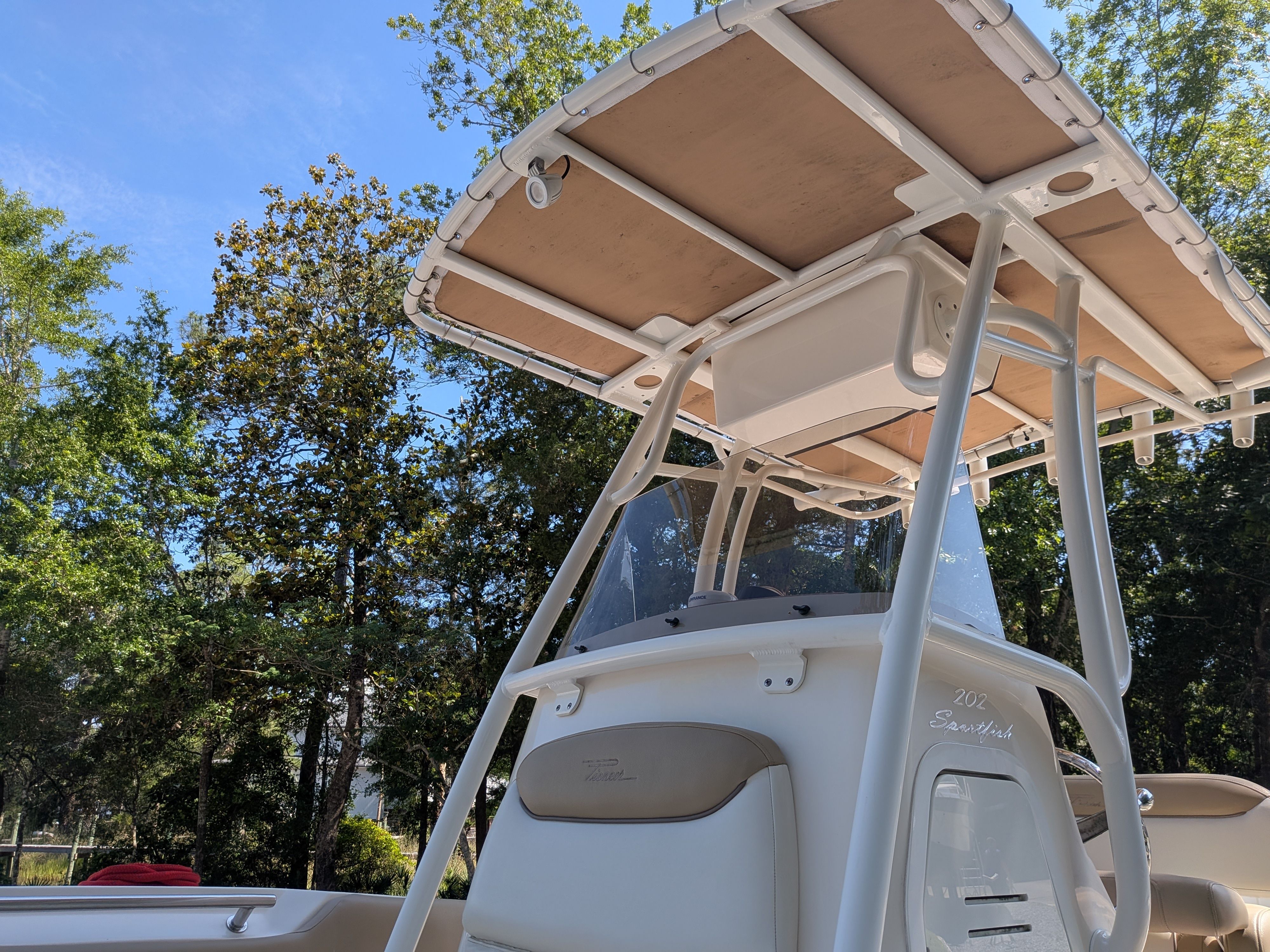 Pioneer 202 Sportfish 2020 boat with T-top outdoors.