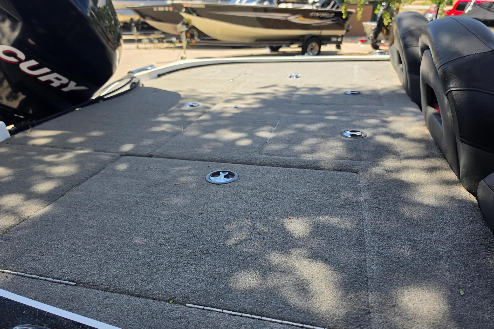 2008 Nitro Z-9 boat deck with carpeted surface and seating, featuring Mercury engine.