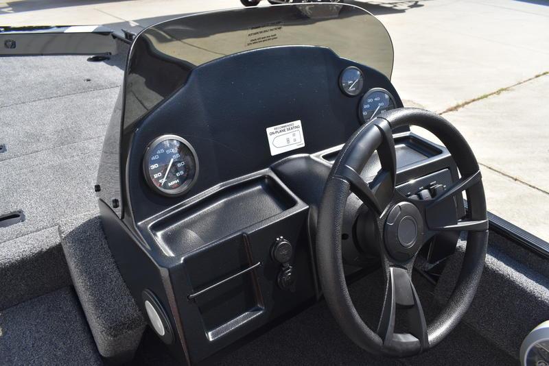 2026 Lowe Skorpion 17 boat dashboard with steering wheel and gauges.