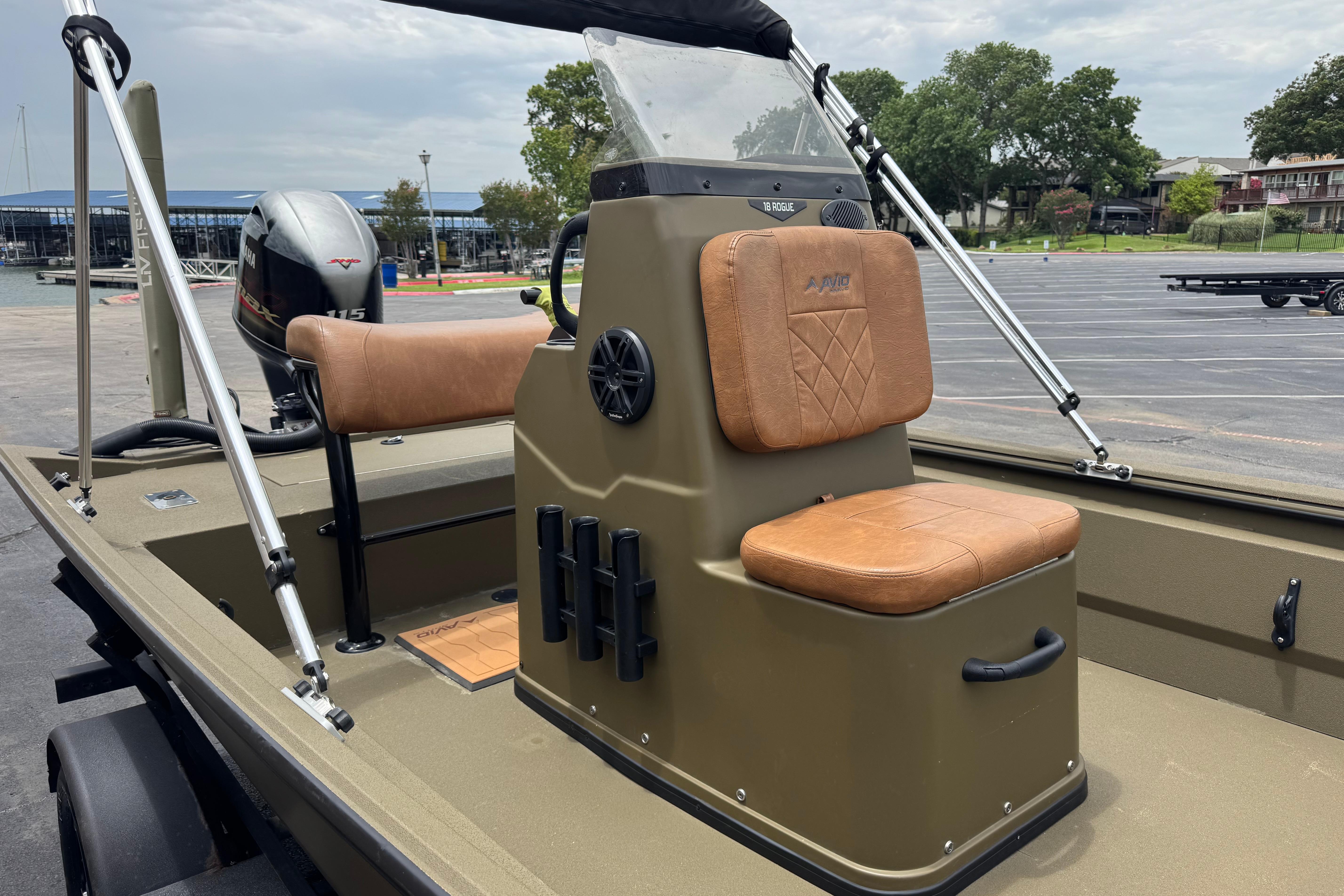 2023 Avid 18 Rogue CC boat with tan seating and Yamaha outboard motor.