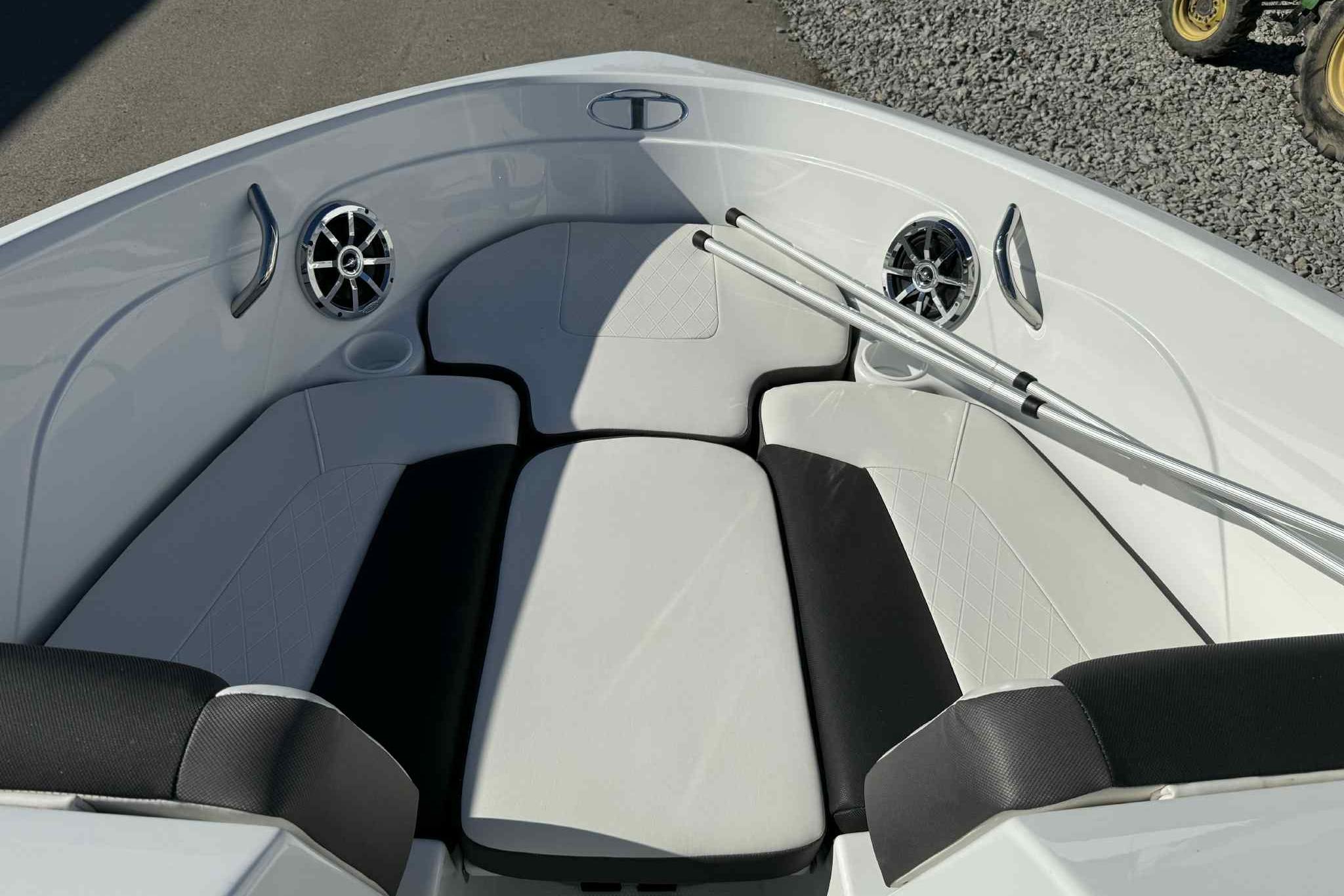 2021 Tahoe 550 TS boat interior with cushioned seating and speakers.