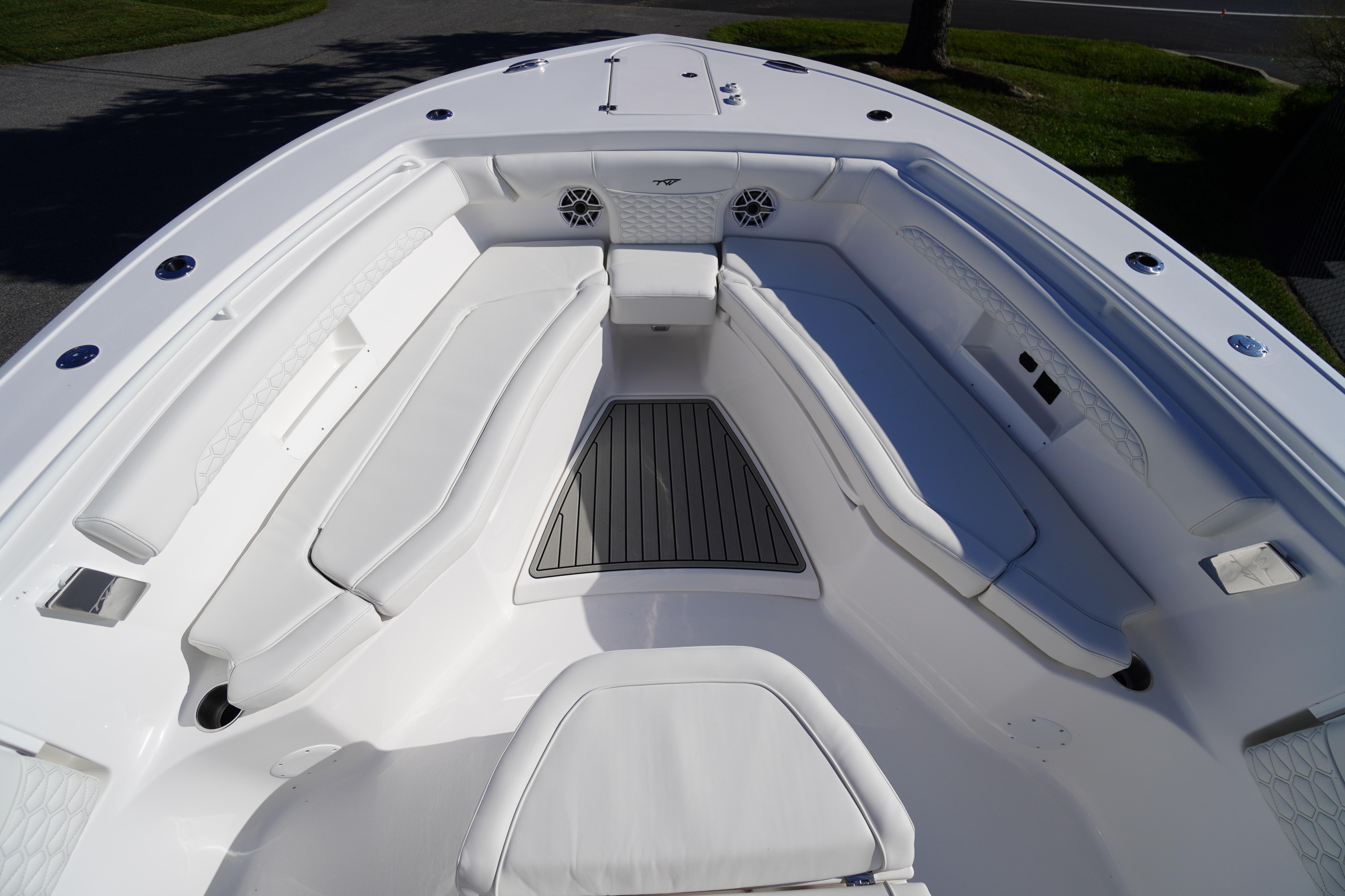 2026 Tidewater 272 LXF boat interior with white seating and deck.