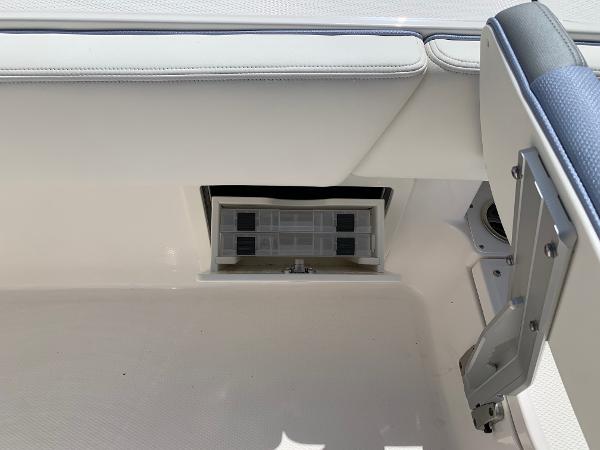 2024 Robalo 266 Cayman storage compartment with cushioned seating.