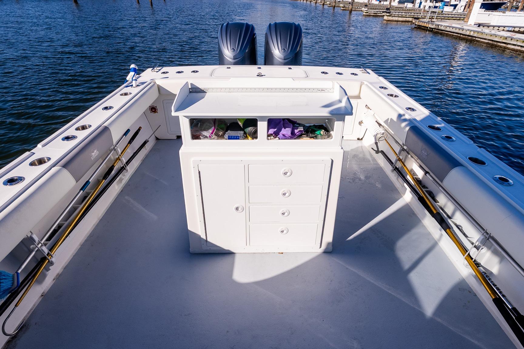 2024 Steiger Craft 31 Fisherman boat deck with fishing rods and storage.