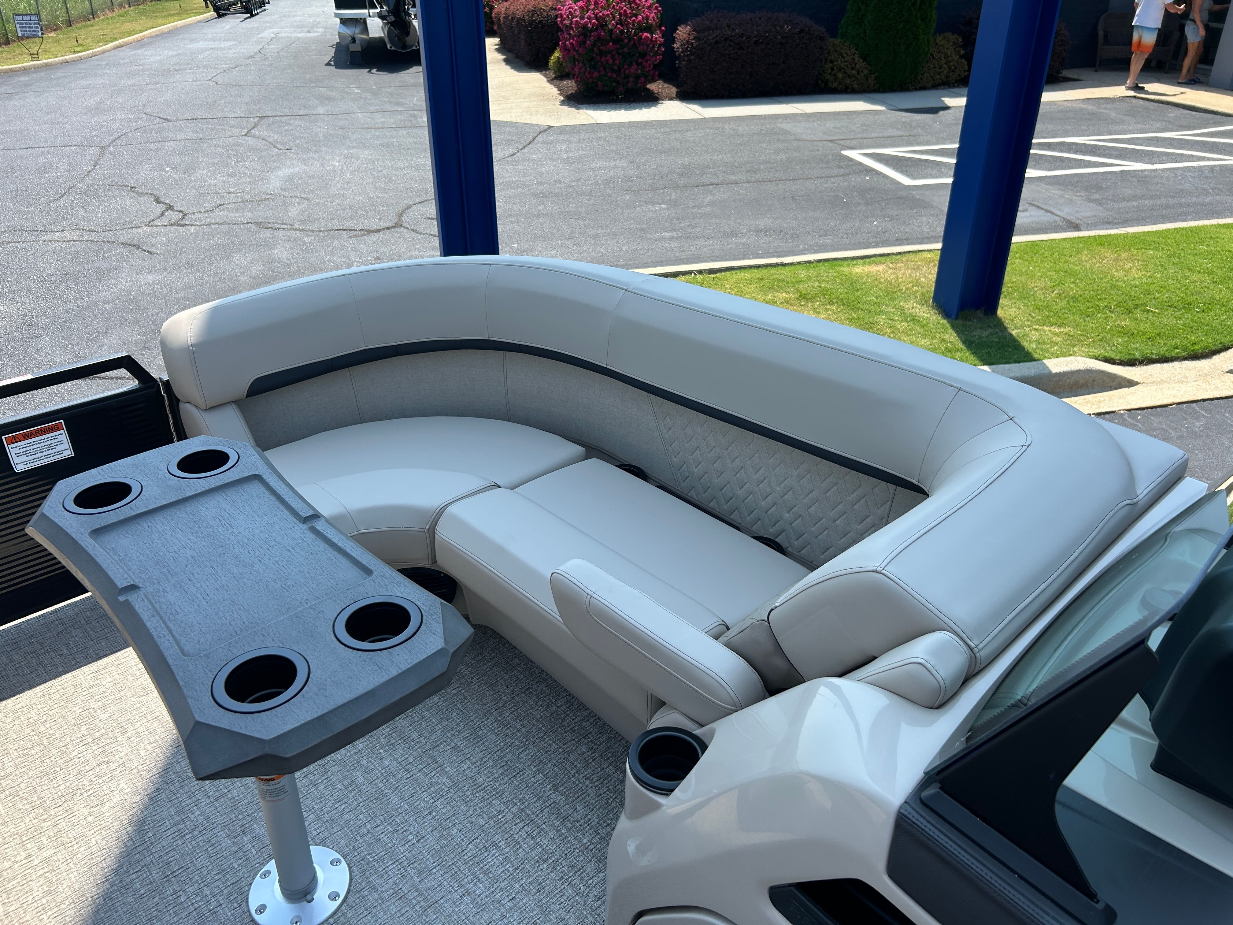 The image shows the interior of a 2026 Bennington 22 MFB boat with an elegant seating area.