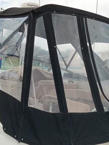 2004 Chaparral Signature 350 boat with clear enclosure and black trim.