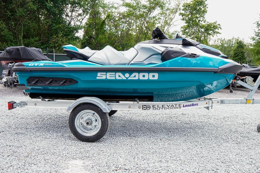 2026 Sea-Doo GTX Limited 325 on trailer, parked outdoors, vibrant blue color.