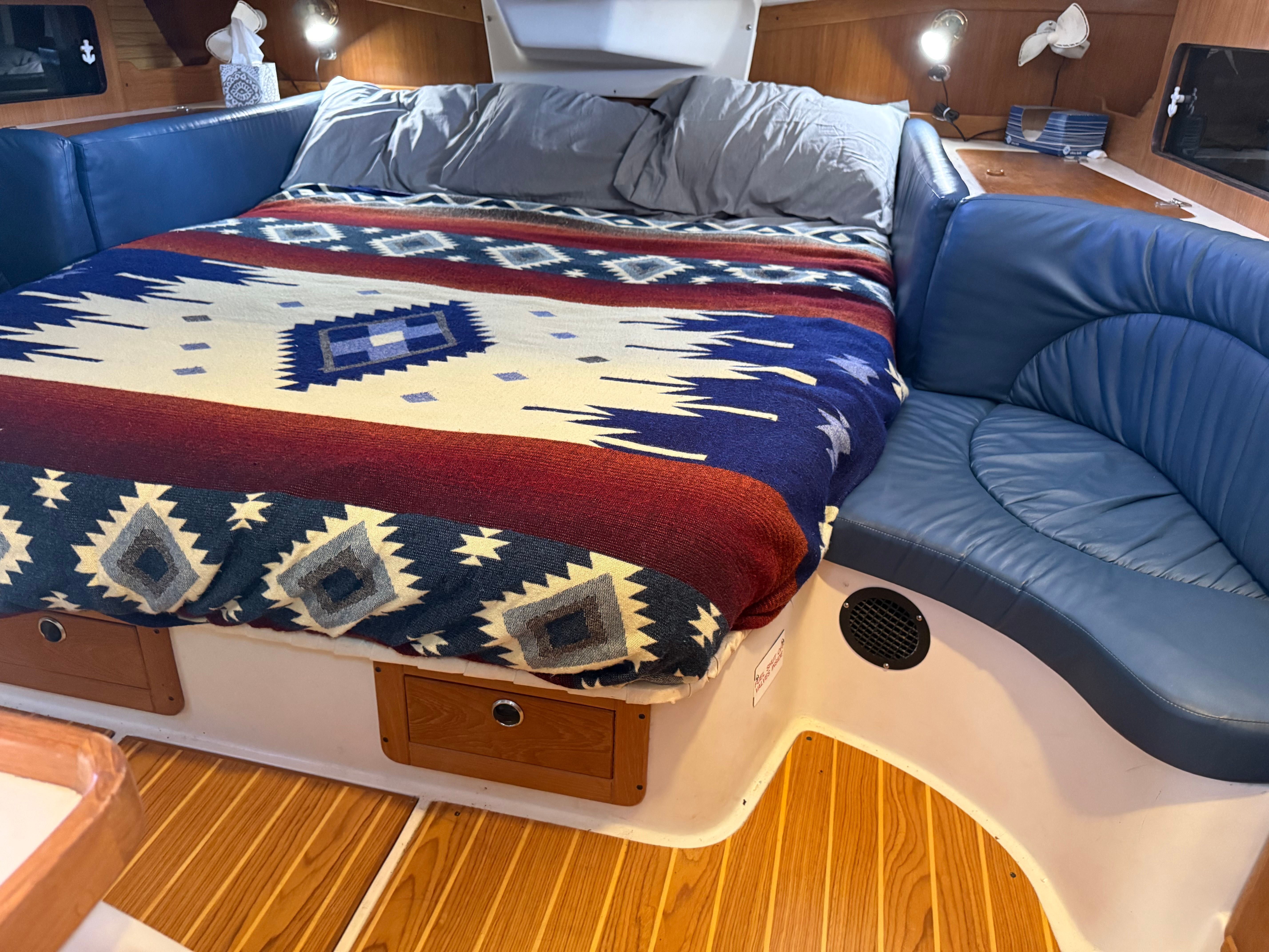 Interior of a 2003 Catalina 380 yacht with cozy bed.