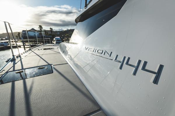 Sleek Vision 444 yacht docked at marina, 2025 model.