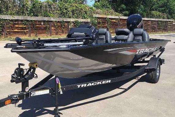 2026 Tracker Pro Team 175 boat on trailer, parked outdoors.