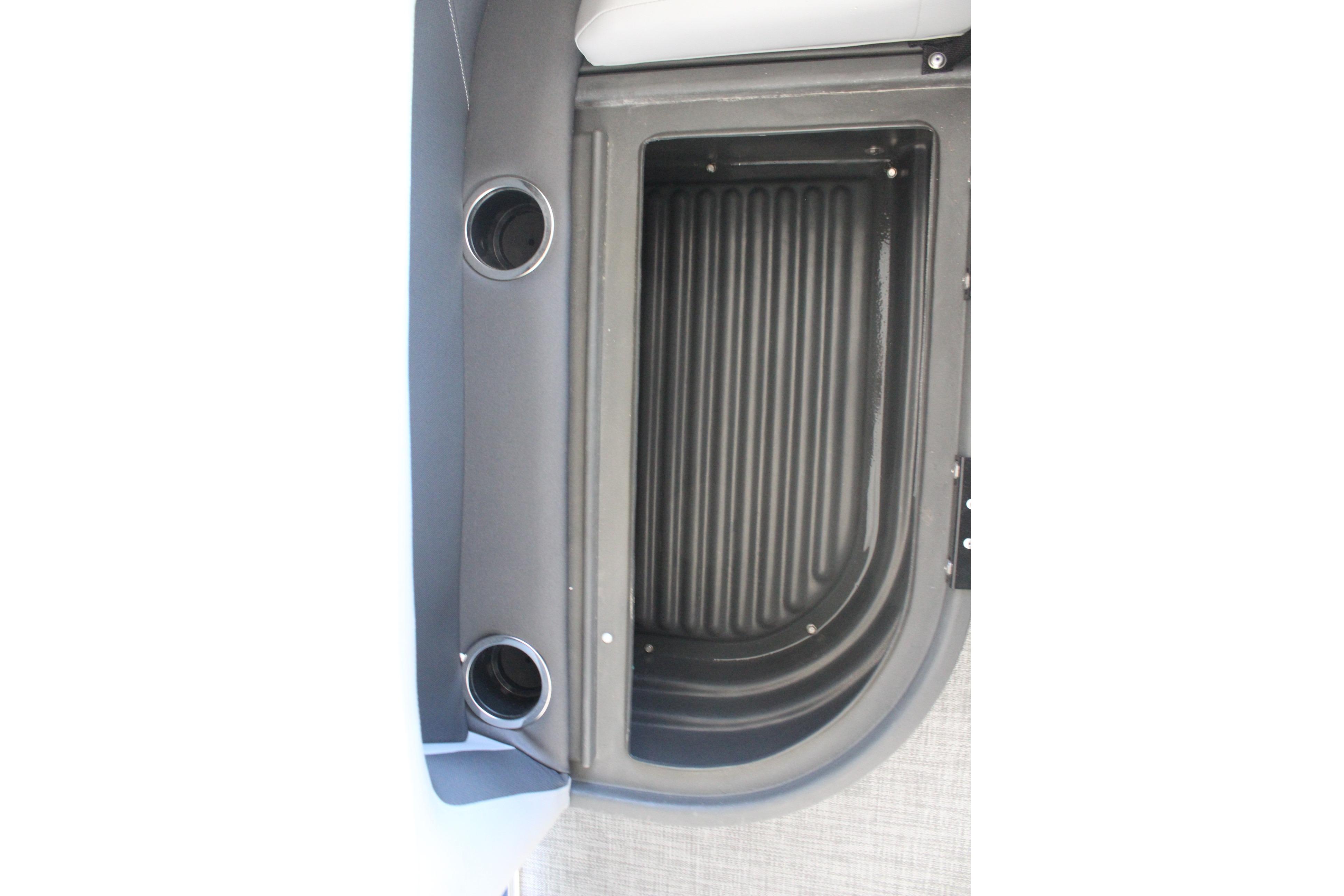 2026 Sun Tracker Party Barge 16 DLX storage compartment with cup holders.