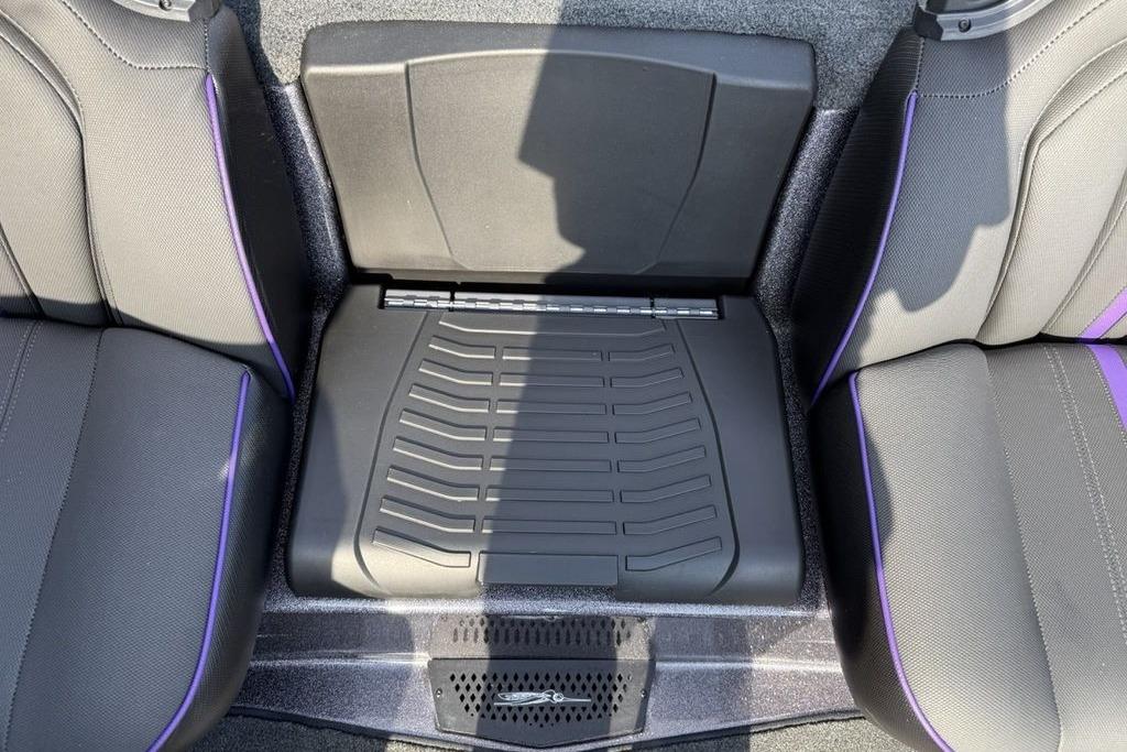 2026 Skeeter ZXE20 interior seating with purple accents and storage compartment.