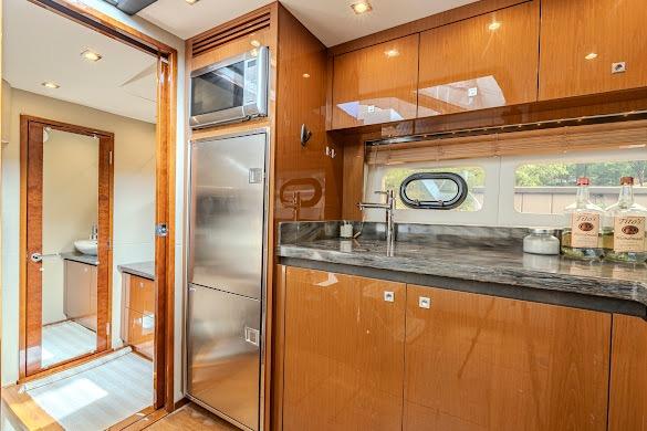 Luxurious 2016 Sea Ray Sundancer 510 yacht interior with modern kitchen amenities.