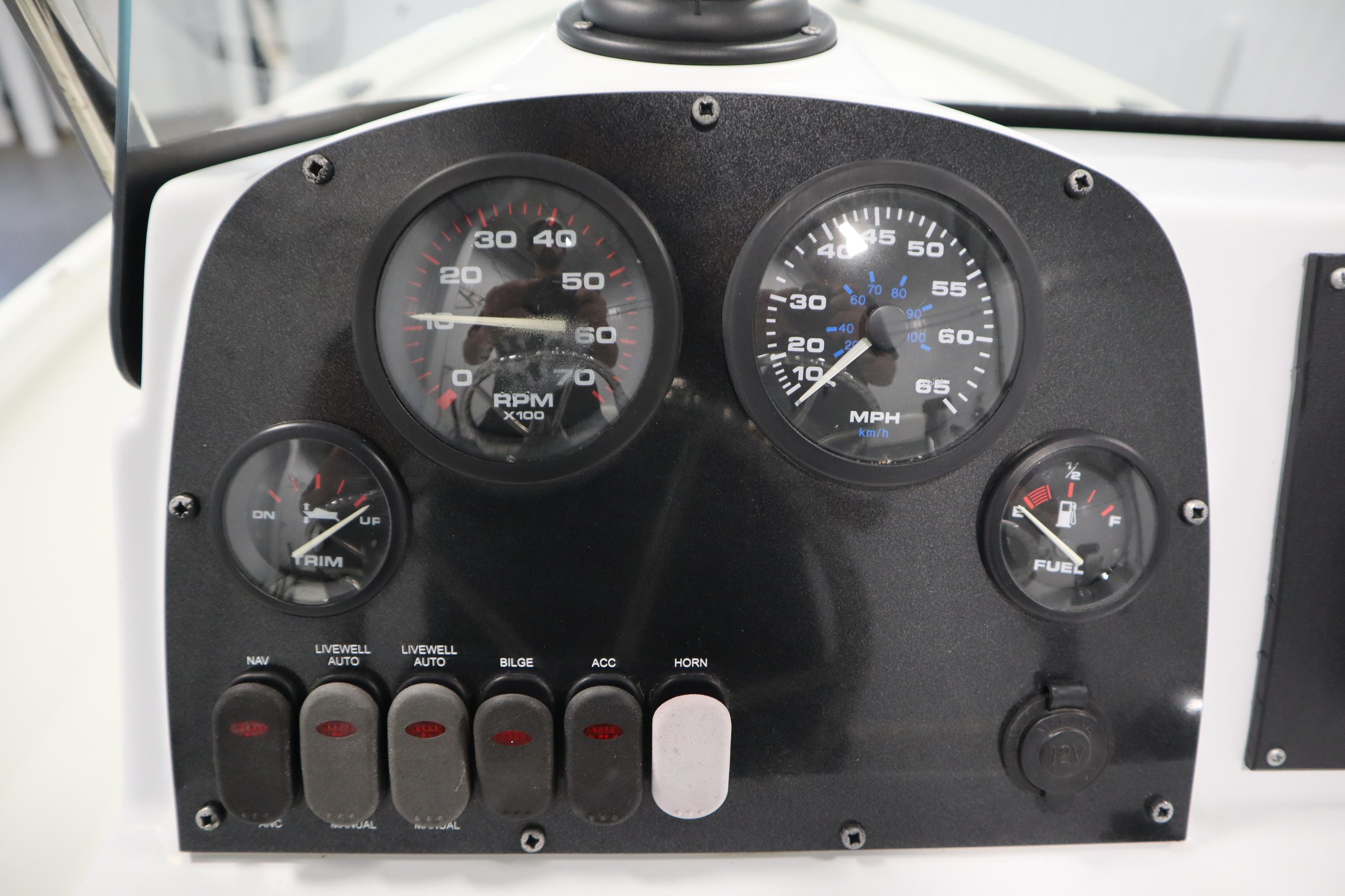 Dashboard of 2022 Crestliner 2200 CC boat with gauges and switches.
