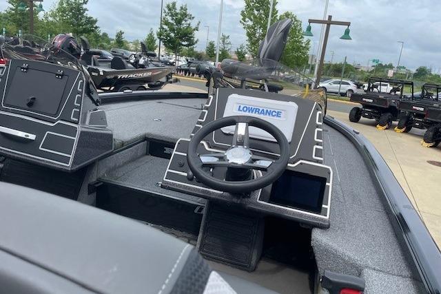 2025 Ranger ALPHA 208 boat dashboard with Lowrance electronics, parked outdoors.