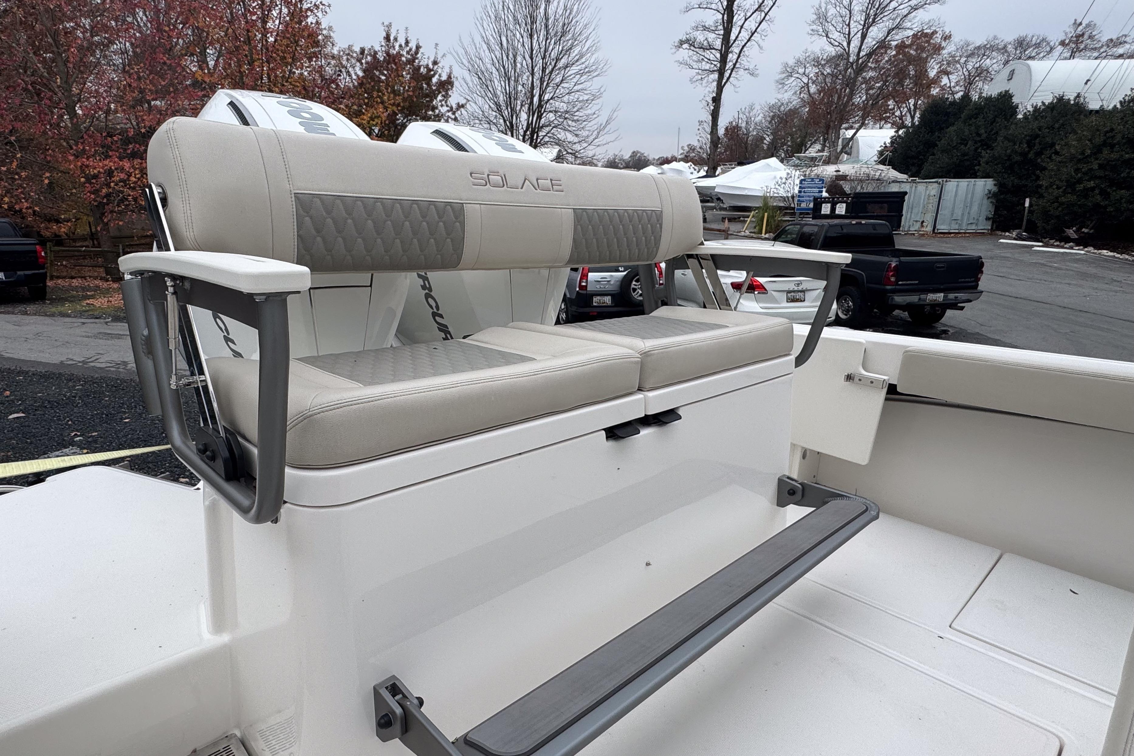 2025 Solace 30 HCS boat seating with armrests, outdoor setting.