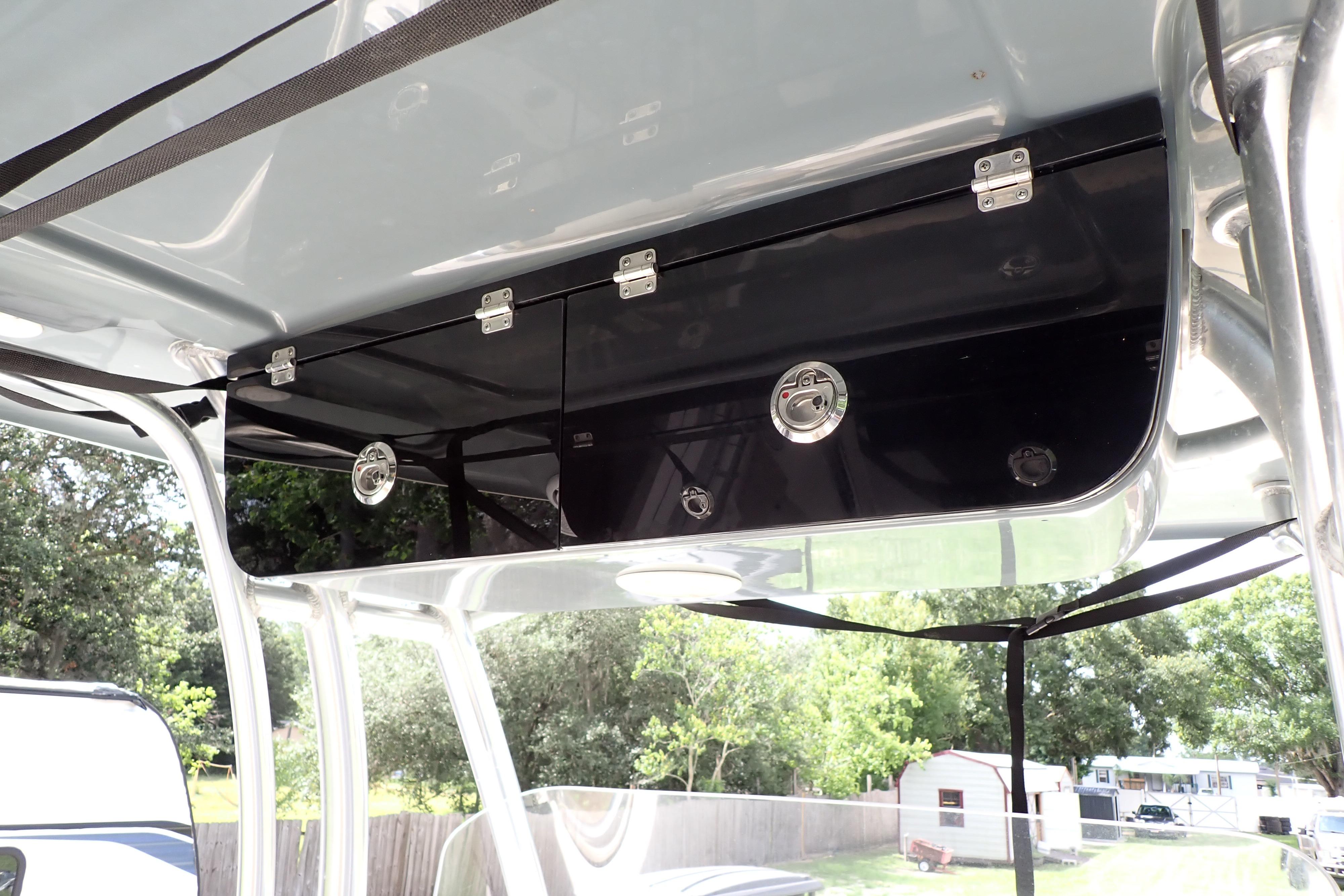 2019 Key West 263 FS boat storage compartment with secure latches and sleek design.