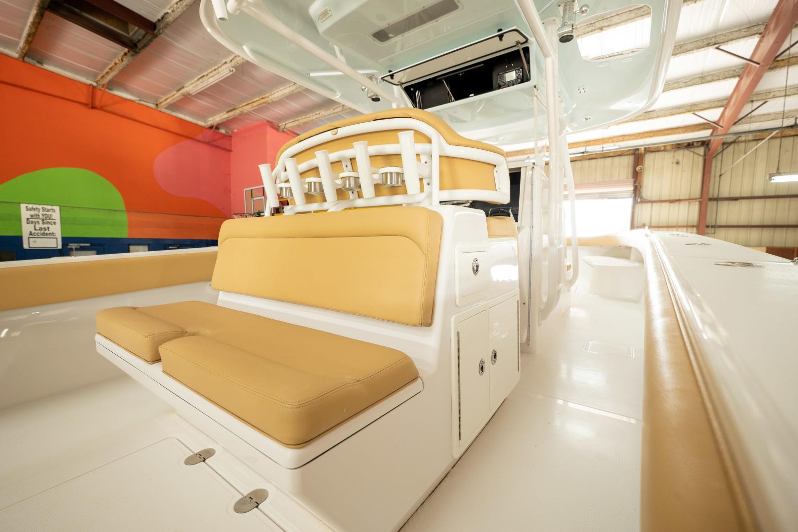 2020 Bahama 41 Open Fisherman boat interior with tan seating in a warehouse.