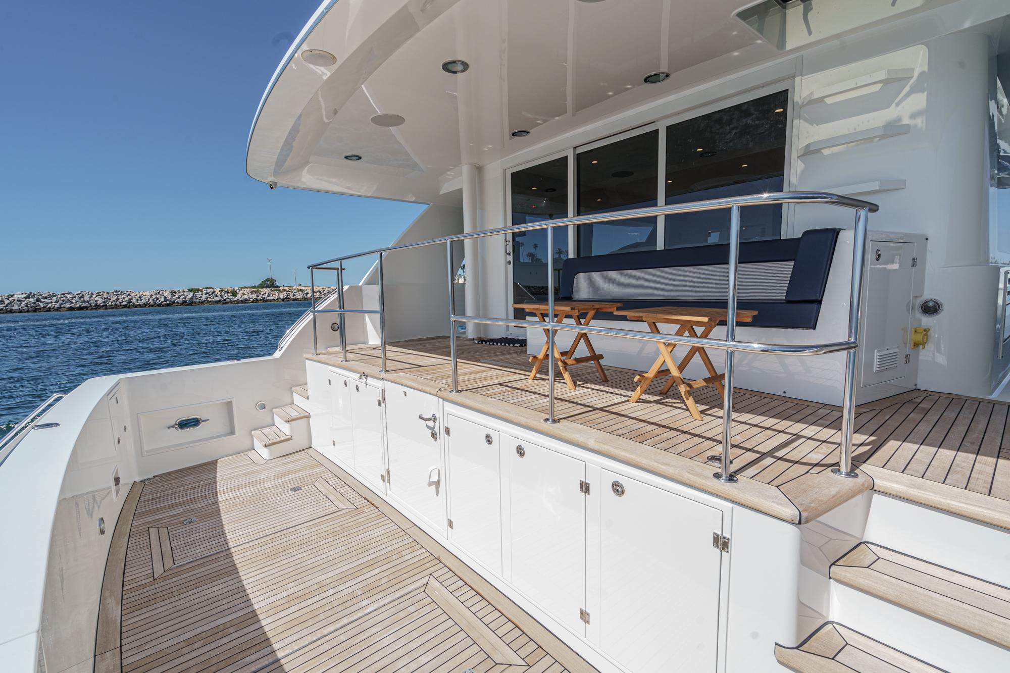 Luxurious Northcoast Yachts Raised Pilothouse 1999, spacious deck with seating, ocean view.