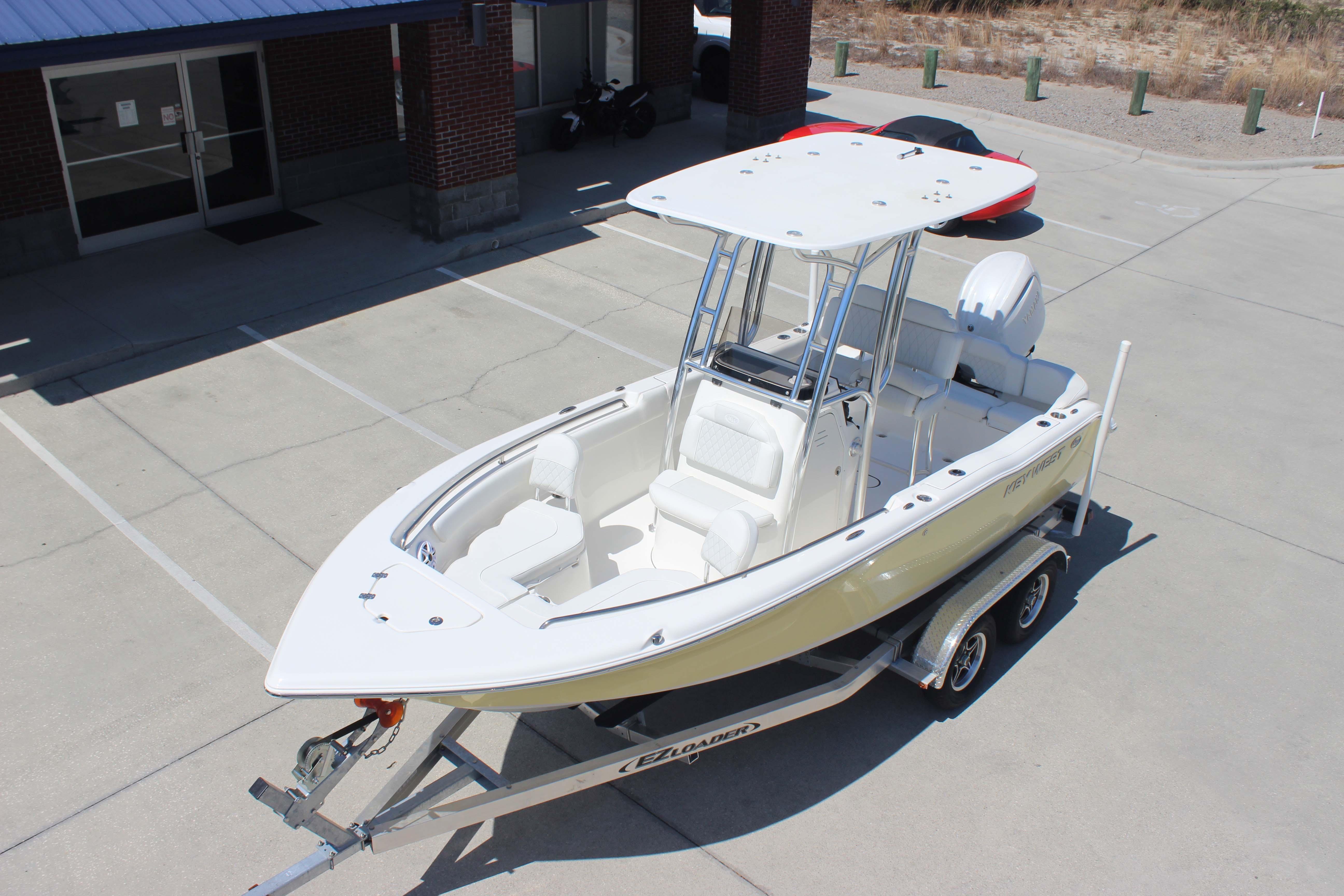 2026 Key West 203 FS boat on trailer in parking lot, featuring sleek design and modern amenities.