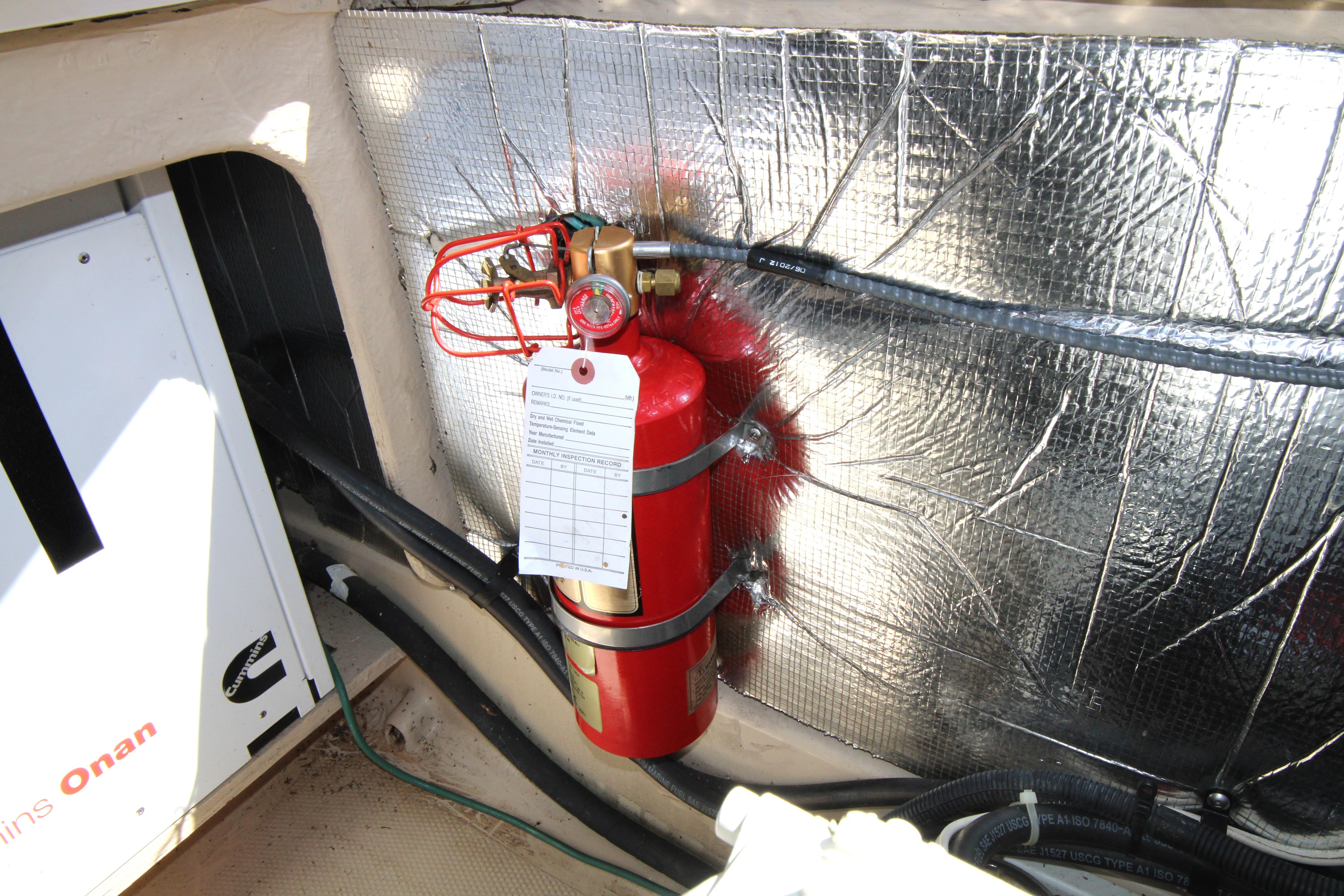 Fire extinguisher in 2013 Ranger Tugs R-31 CB engine room with insulation.