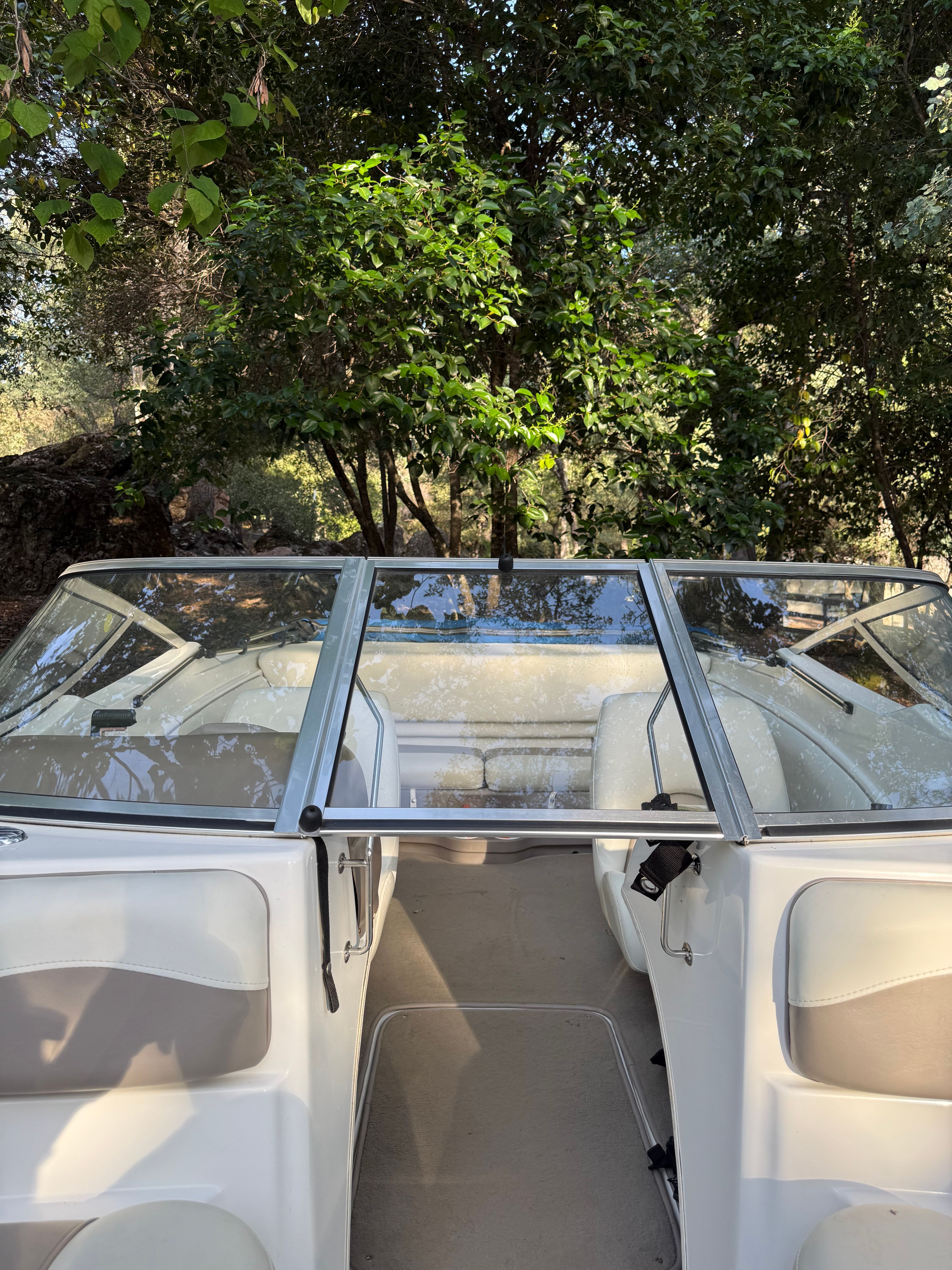 Interior of a 2003 Glastron SX 195 boat outdoors.
