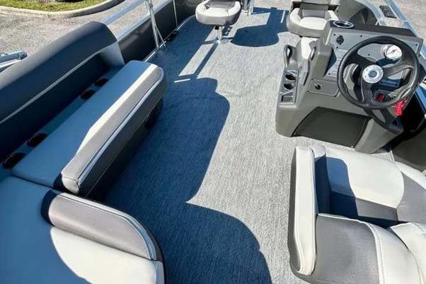 2026 Sun Tracker Bass Buggy 16 XL Select interior with seating and steering console.