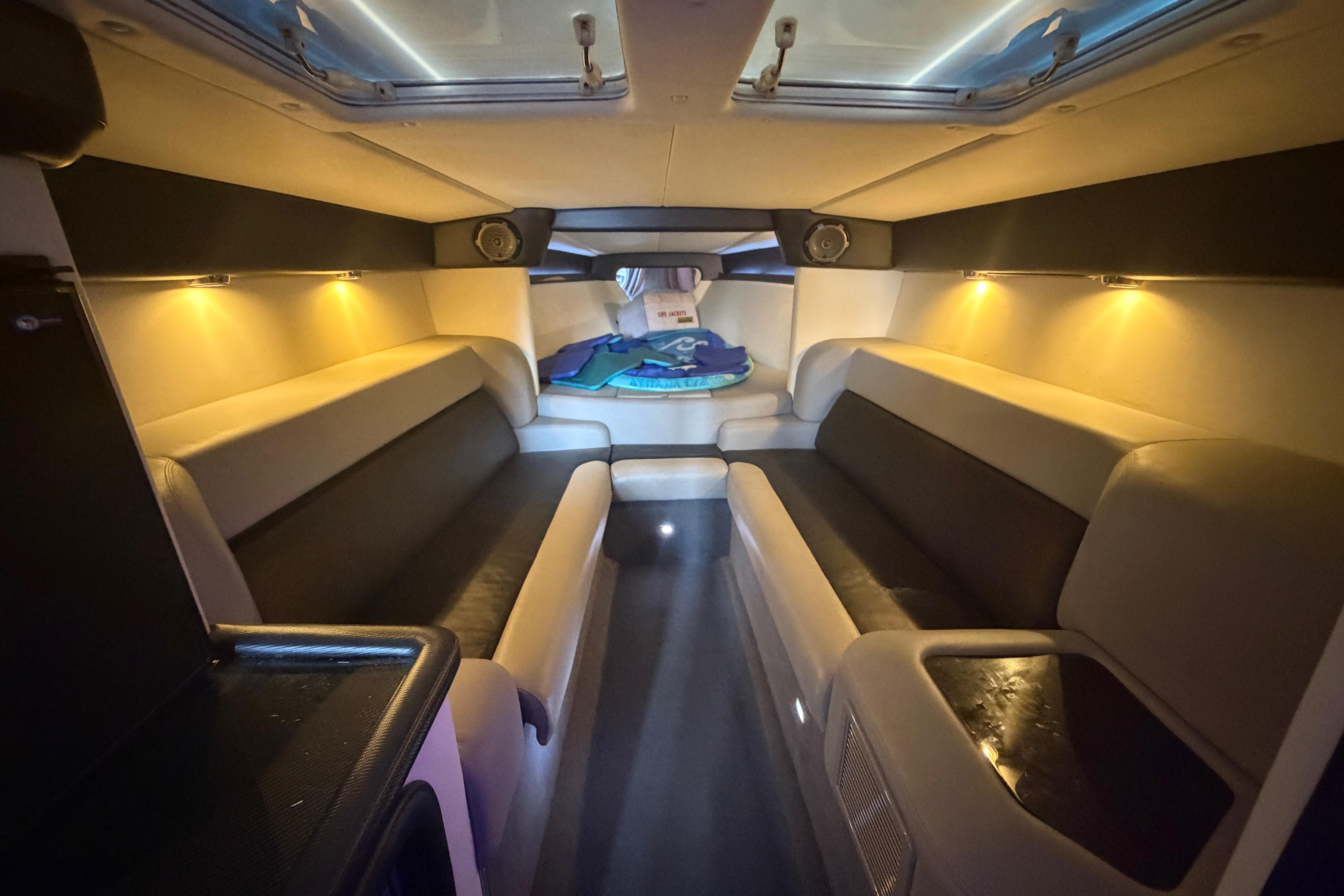 Luxurious interior of 2013 Nor-Tech 477 SPX Vee Bottom boat with ambient lighting.
