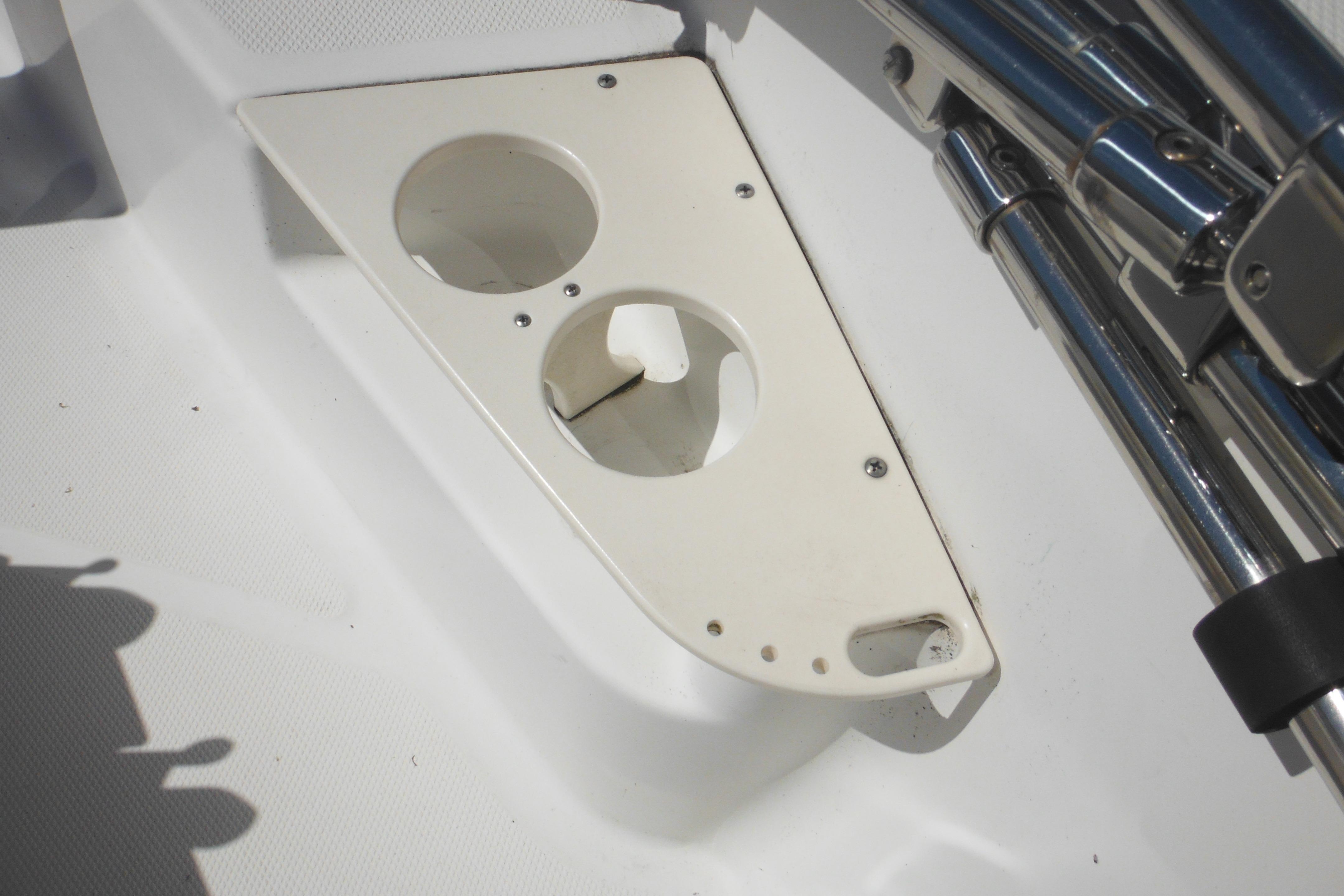 Cup holders on a 2009 Boston Whaler 200 Dauntless boat deck.
