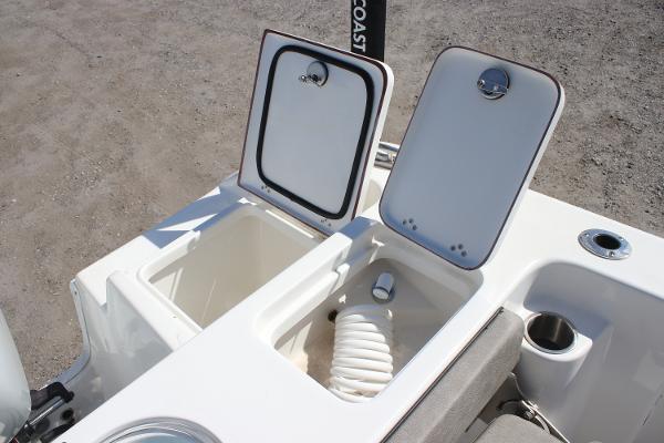 2023 Sea Pro 239 Center Console boat storage compartments open, showcasing interior features.