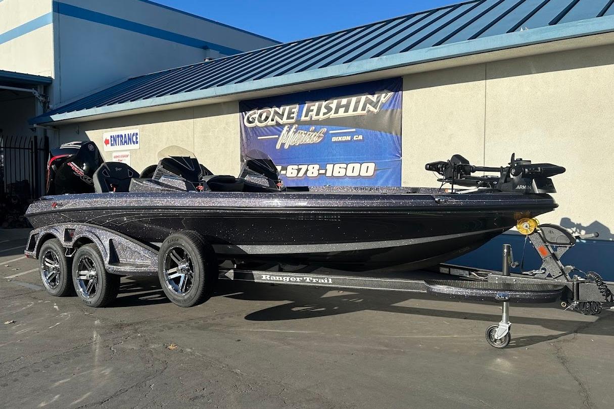 2026 Ranger Z521R Garmin Cup-Equipped boat on trailer outside a fishing store.