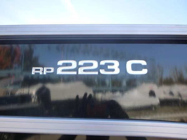 Close-up of 2024 Ranger Reata 223C model emblem on a reflective surface.