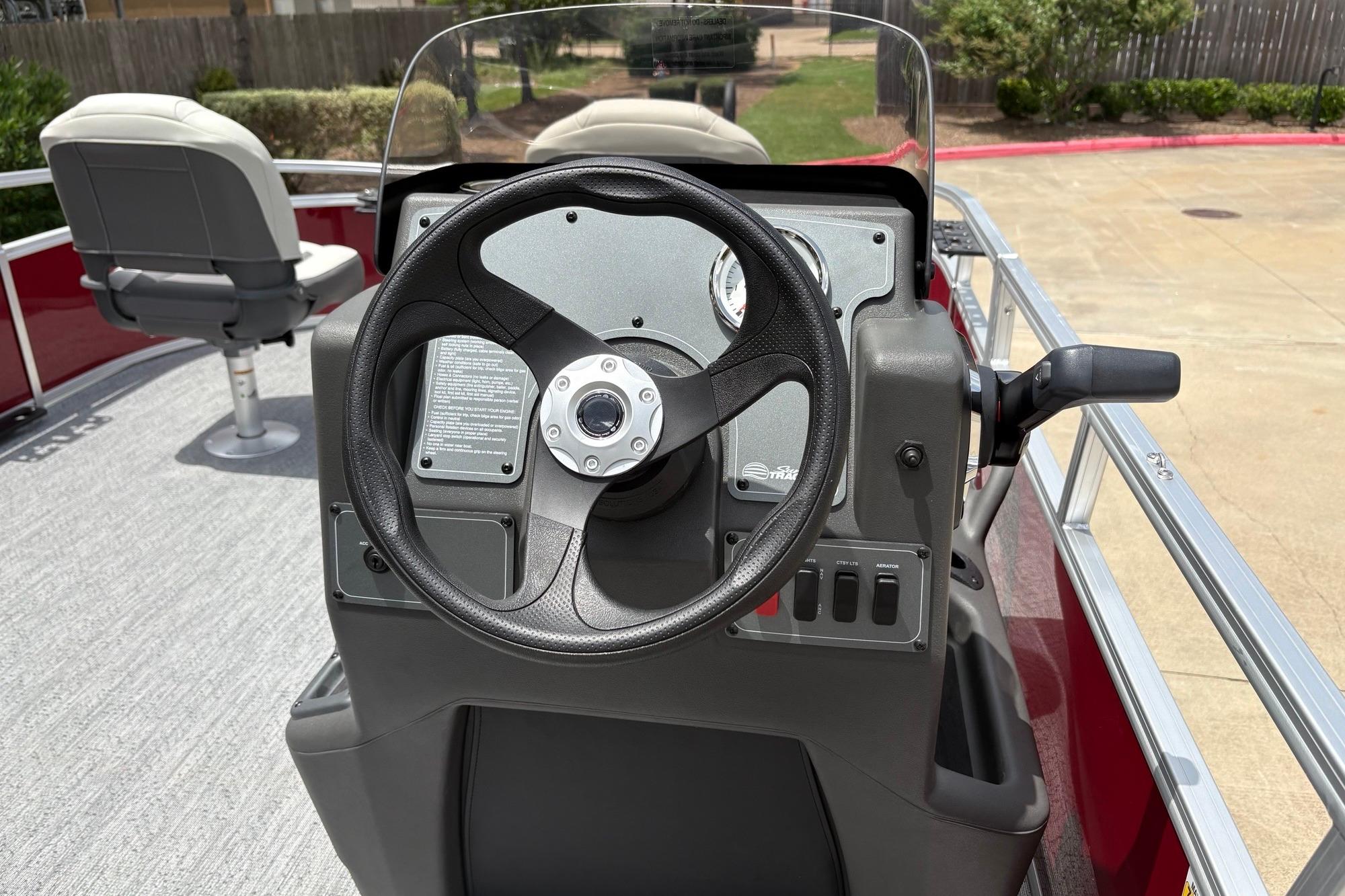 Steering console of 2026 Sun Tracker Bass Buggy 16 XL Select pontoon boat.
