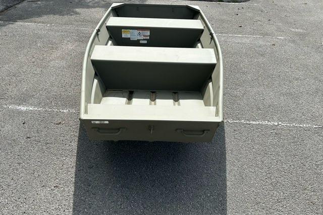 2026 Tracker Grizzly 12 Jon boat on pavement, showcasing its sturdy aluminum build.