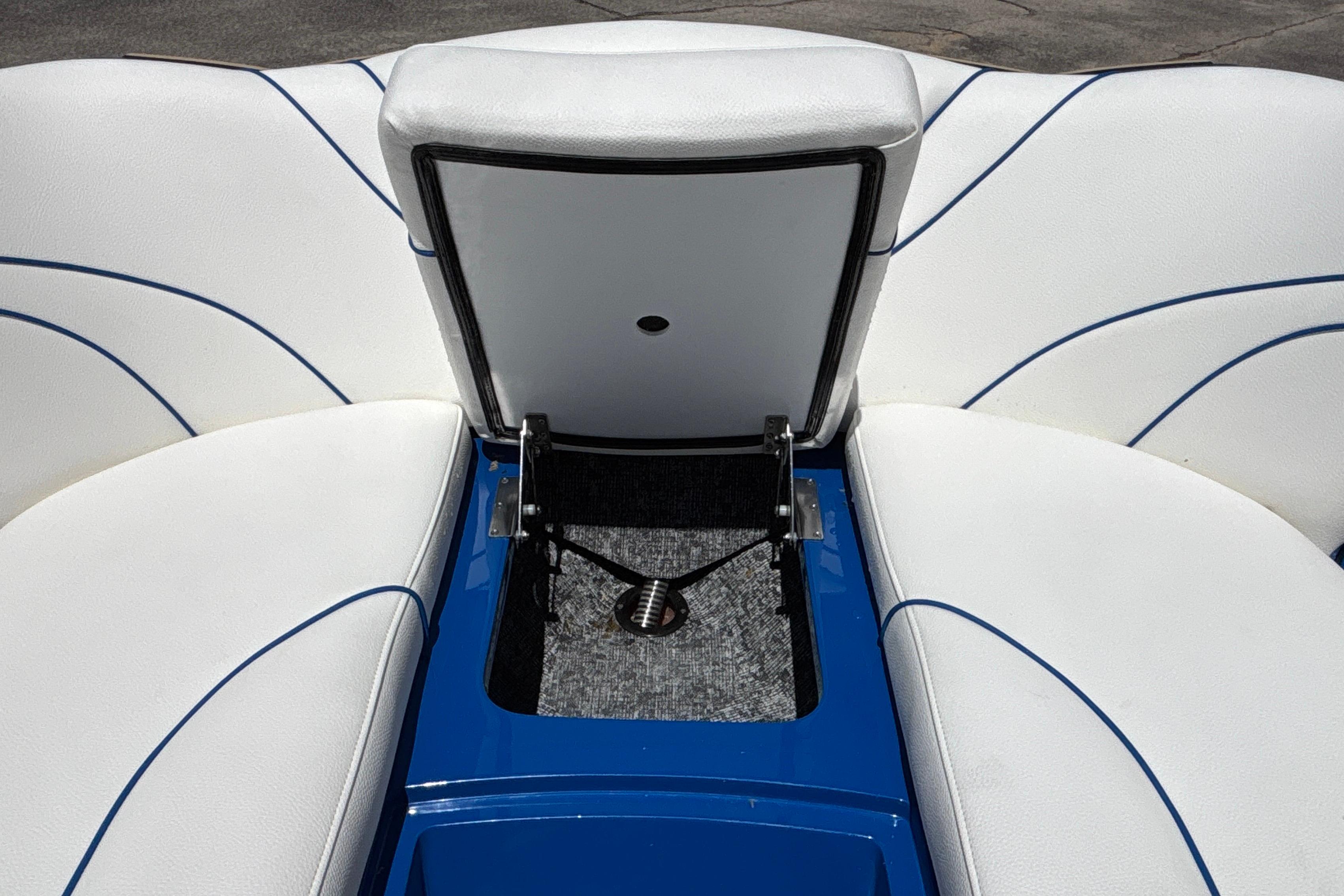 2026 MB B52 23 Alpha boat interior with white seating and blue accents.