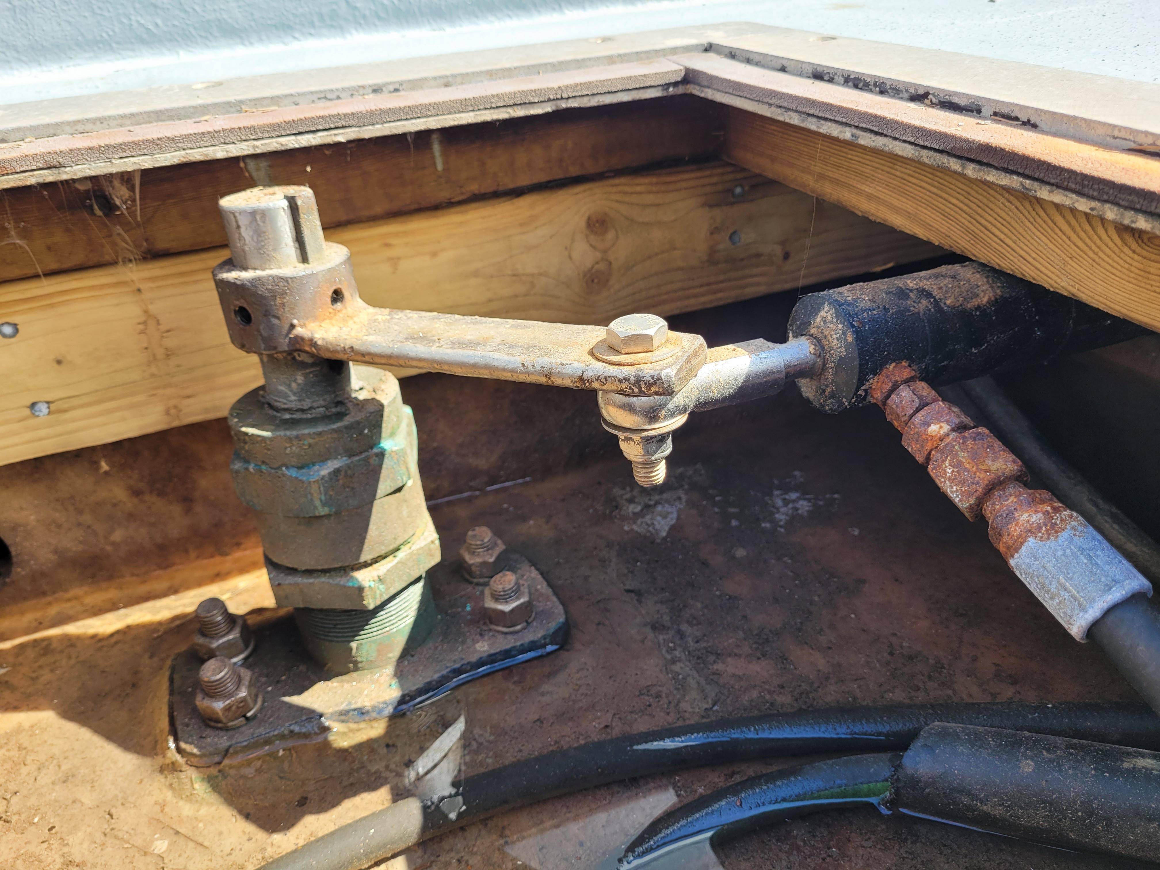 Steering mechanism of 2022 Custom Dana Hunter Cape Island 28 boat, showing metal components and cables.