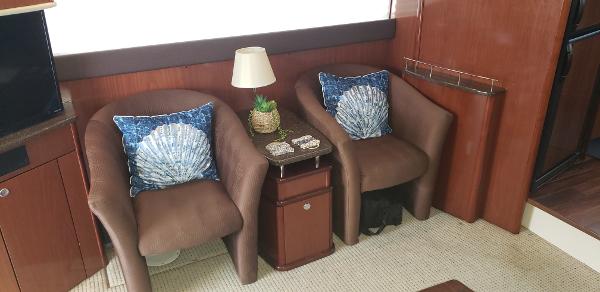 Interior of 2010 Meridian 441 Sedan with cozy seating and nautical decor.