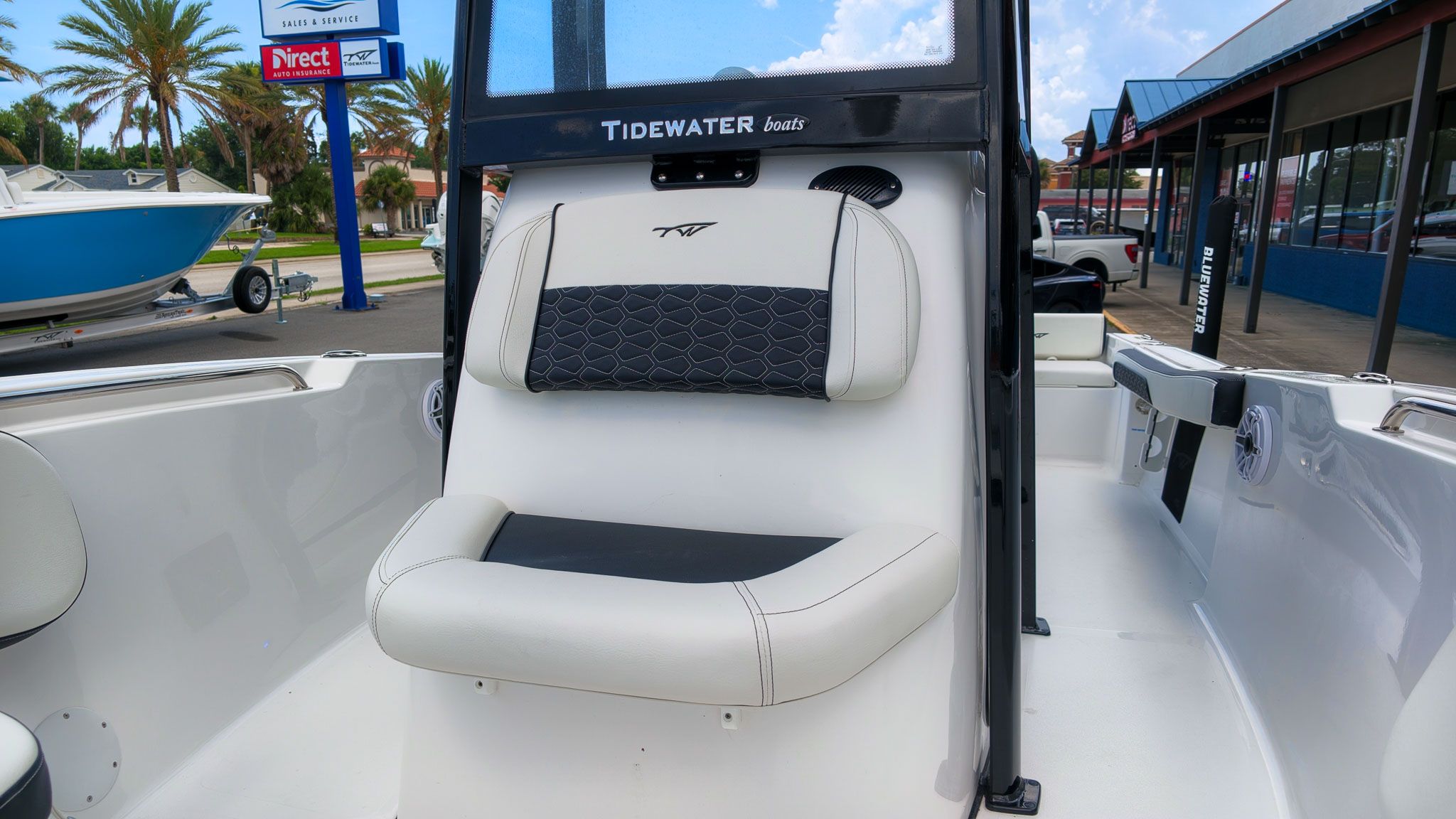 The image shows the cockpit of a Tidewater 198 CC Adventure boat with comfortable seating.