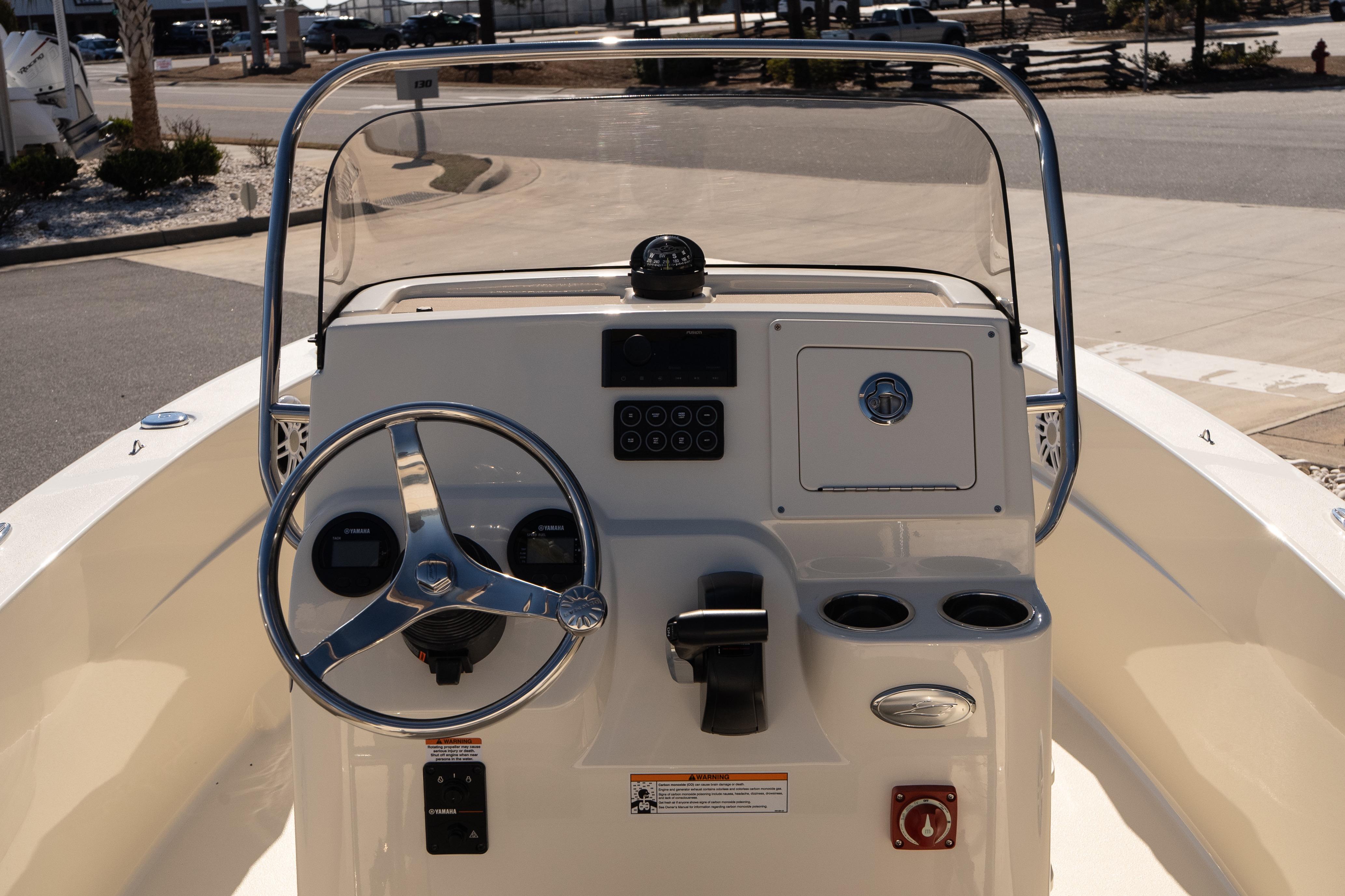 2026 Scout 188 Sportfish boat console with steering wheel and controls.