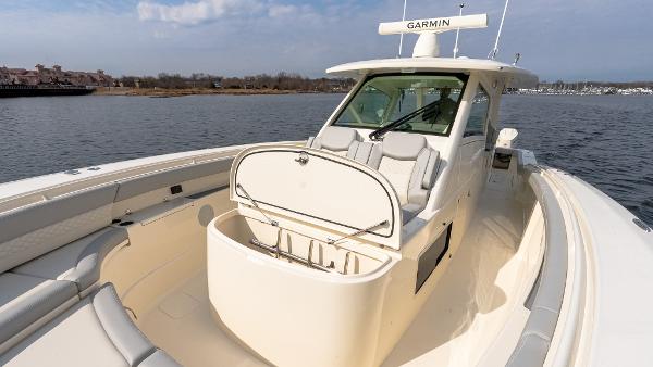 2025 Scout 425 LXF boat with Garmin equipment on calm water.